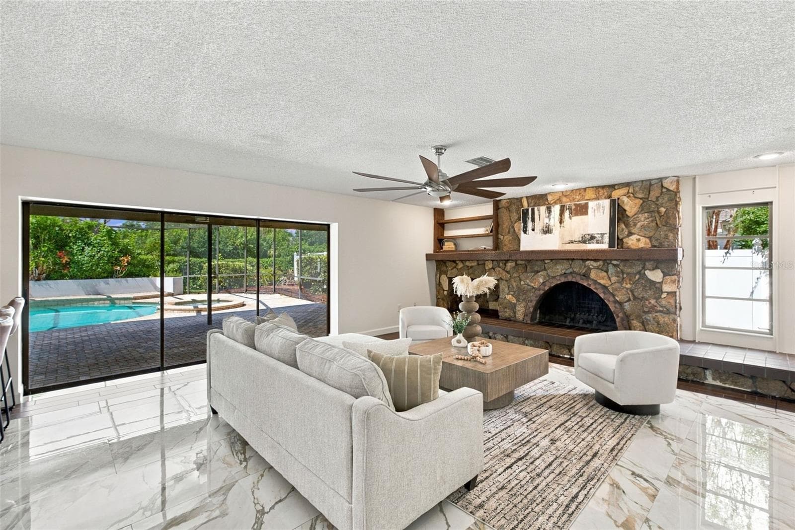 Living Room Sliders Fully Open to Enclosed Pool - 2924 TORREY PINES CT, CLEARWATER