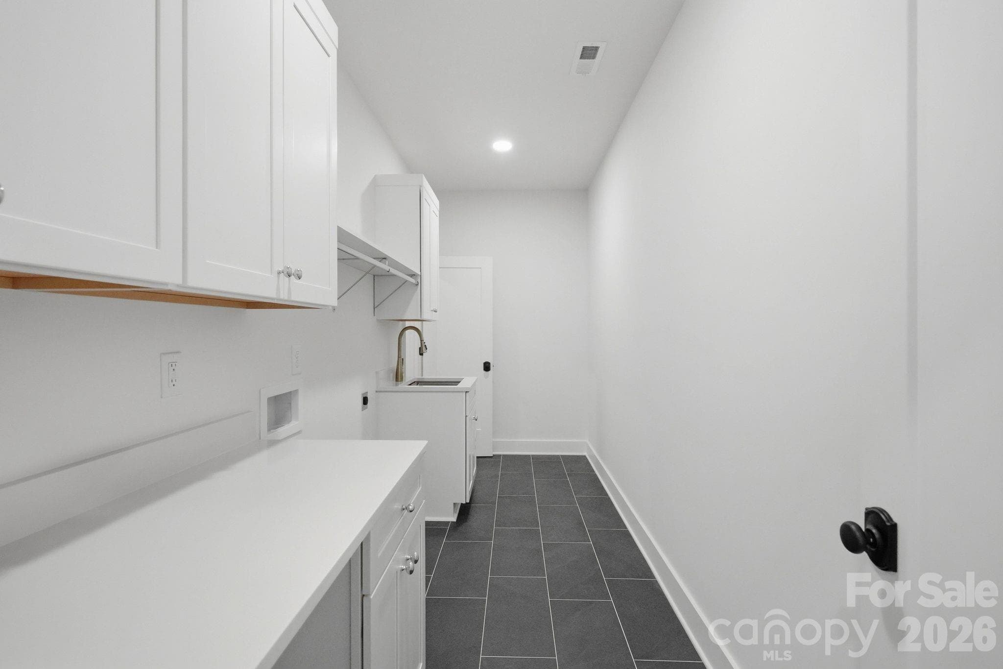 Primary closet (accessed via primary suite and upper-level hallway) - 1117 Lomax Avenue, Charlotte