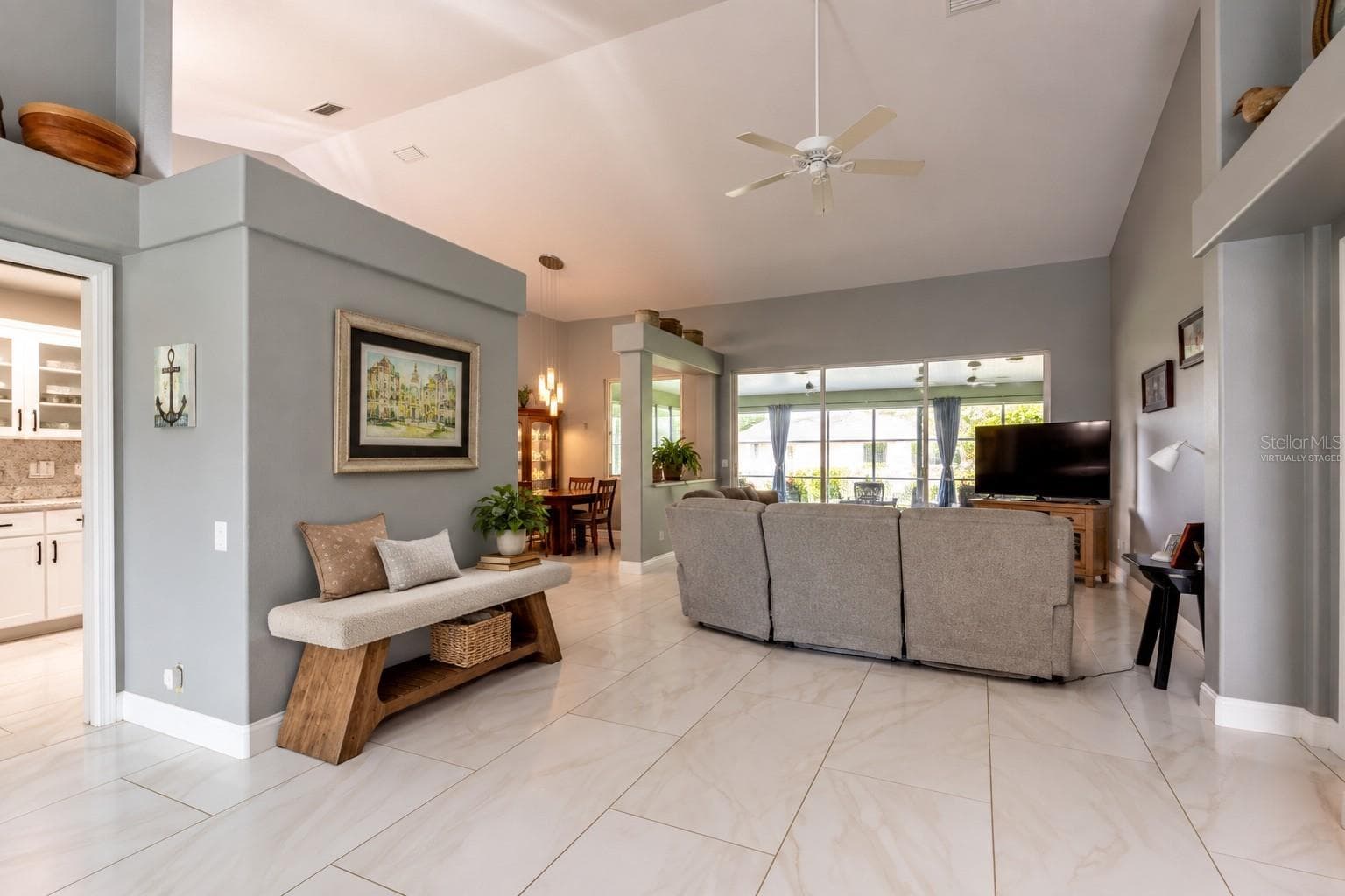 Virtually staged bench providing a convenient spot for guests to sit and place personal belongings. - 4465 FAIRWAY OAKS DR, MULBERRY