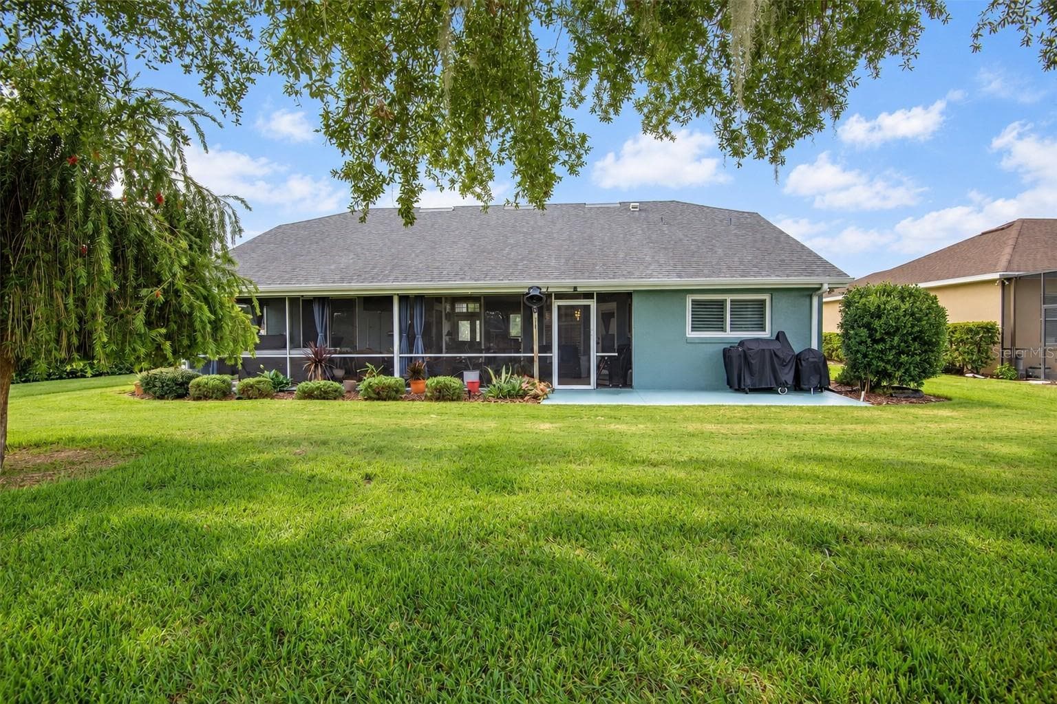 Large lanai and patio for grilling. - 4465 FAIRWAY OAKS DR, MULBERRY