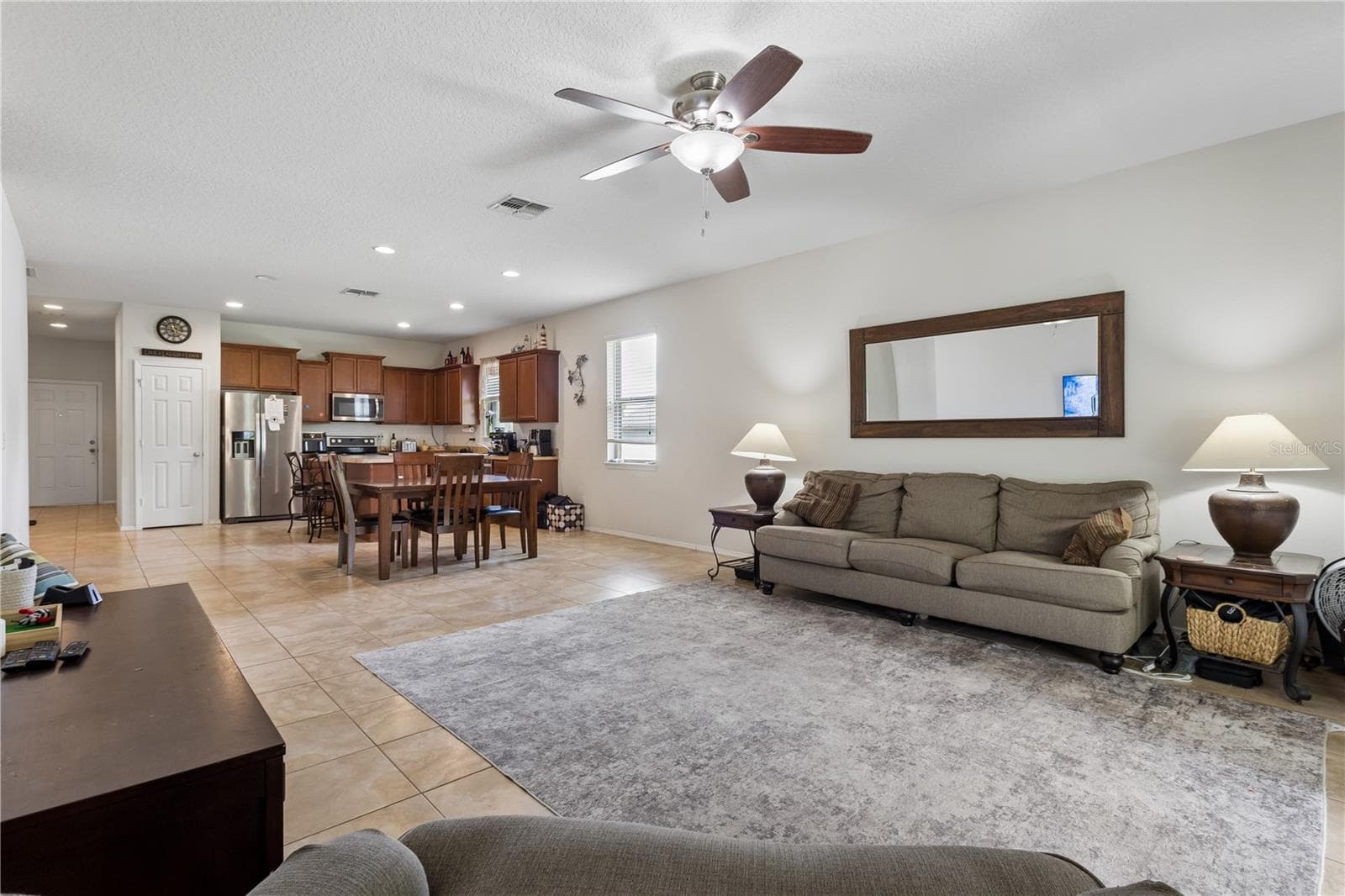 Open concept for the kitchen, dining and family rooms. - 30022 DONNINGTON LOOP, MOUNT DORA