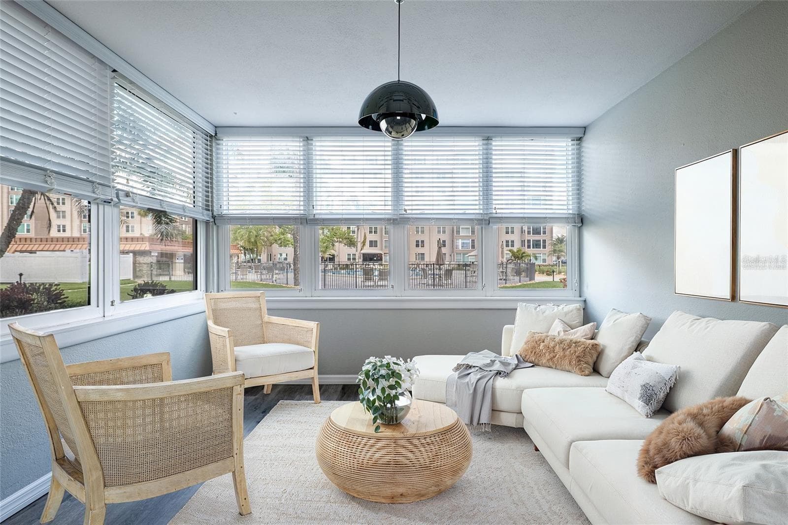 Beautiful sun room overlooking the pool and offering fantastic sunset views - 620 EDGEWATER DR #103, DUNEDIN