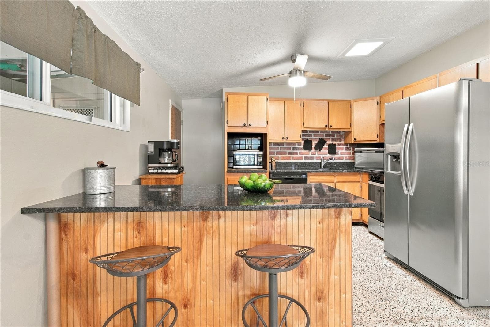 Kitchen with breakfast bar - 3019 FLORIDA BLVD, BRADENTON