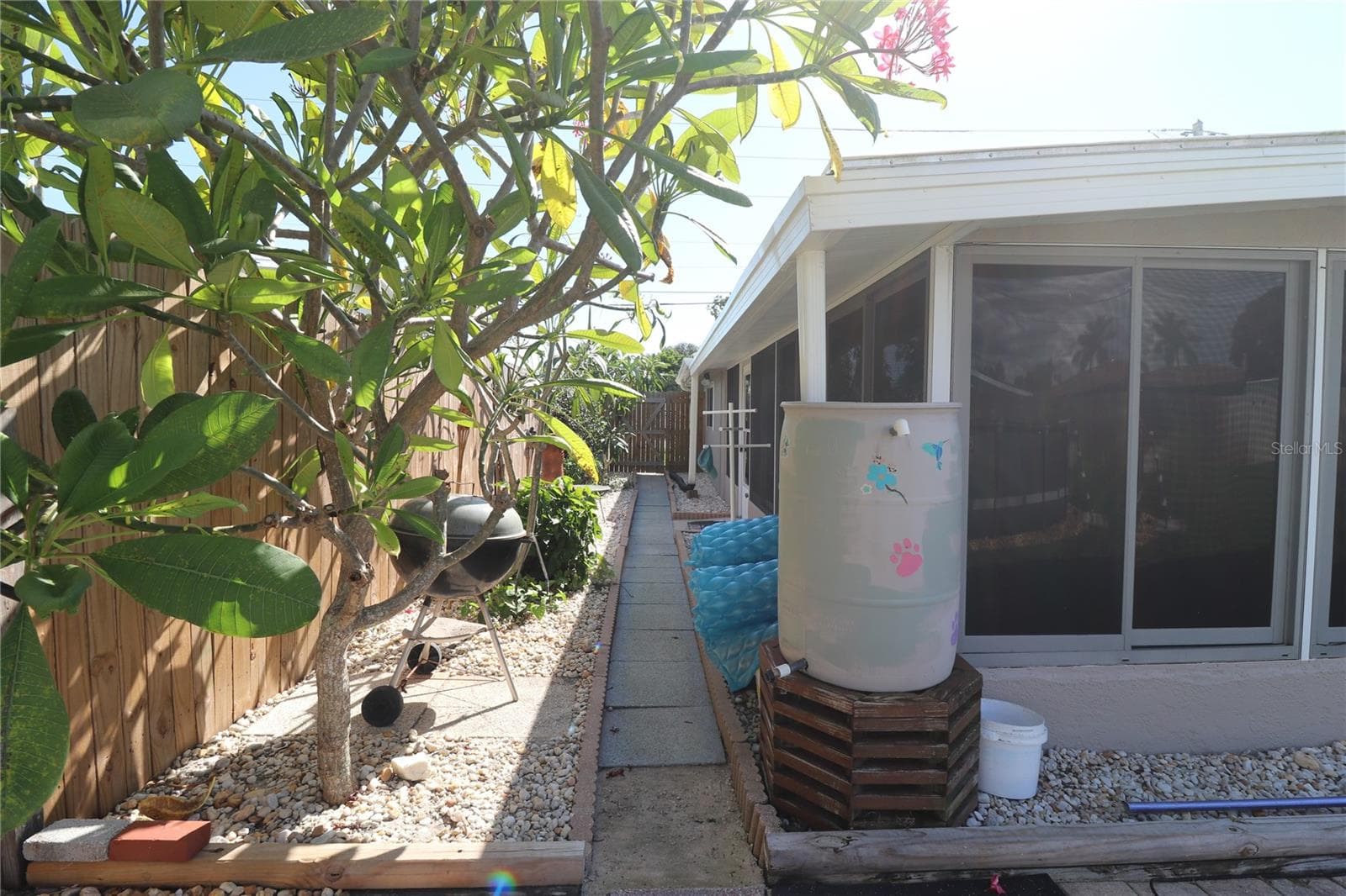 Side yard area with Plumeria Trees - 3019 FLORIDA BLVD, BRADENTON