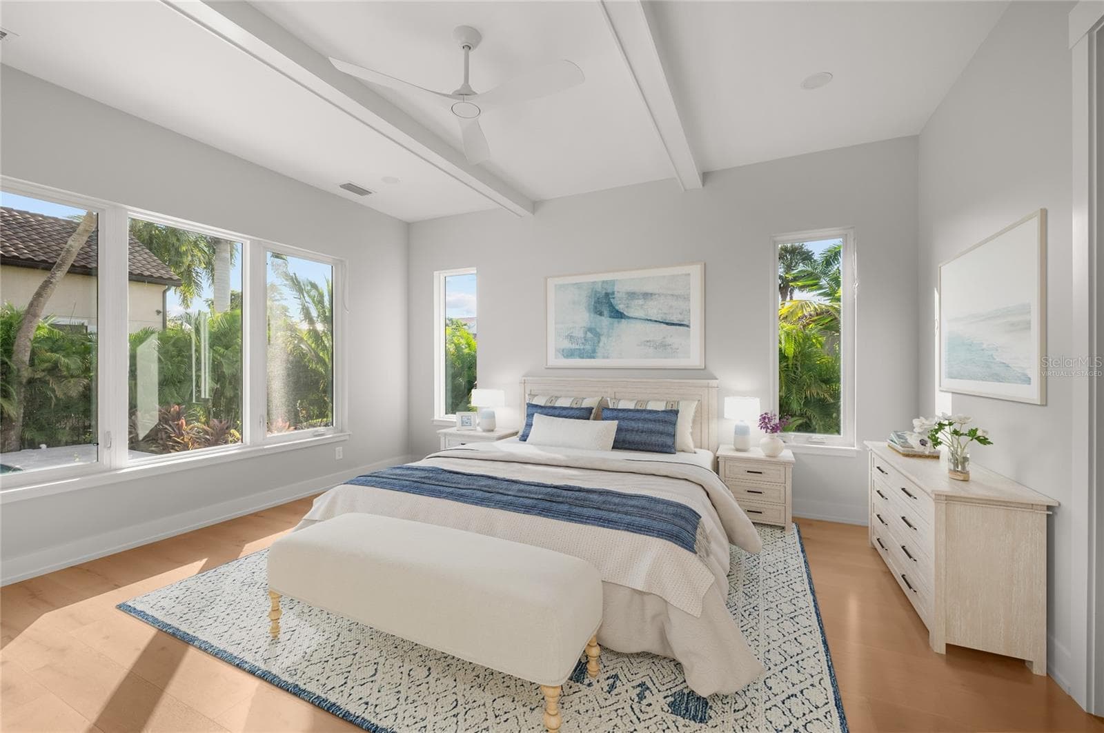 Virtually staged primary suite featuring elevated custom trim and refined architectural detailing. - 3360 BAYOU SOUND, LONGBOAT KEY