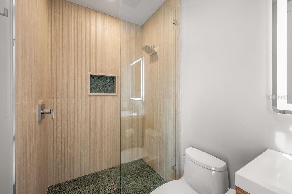 5th bedroom en suite features this custom designed walk in shower. - 3360 BAYOU SOUND, LONGBOAT KEY