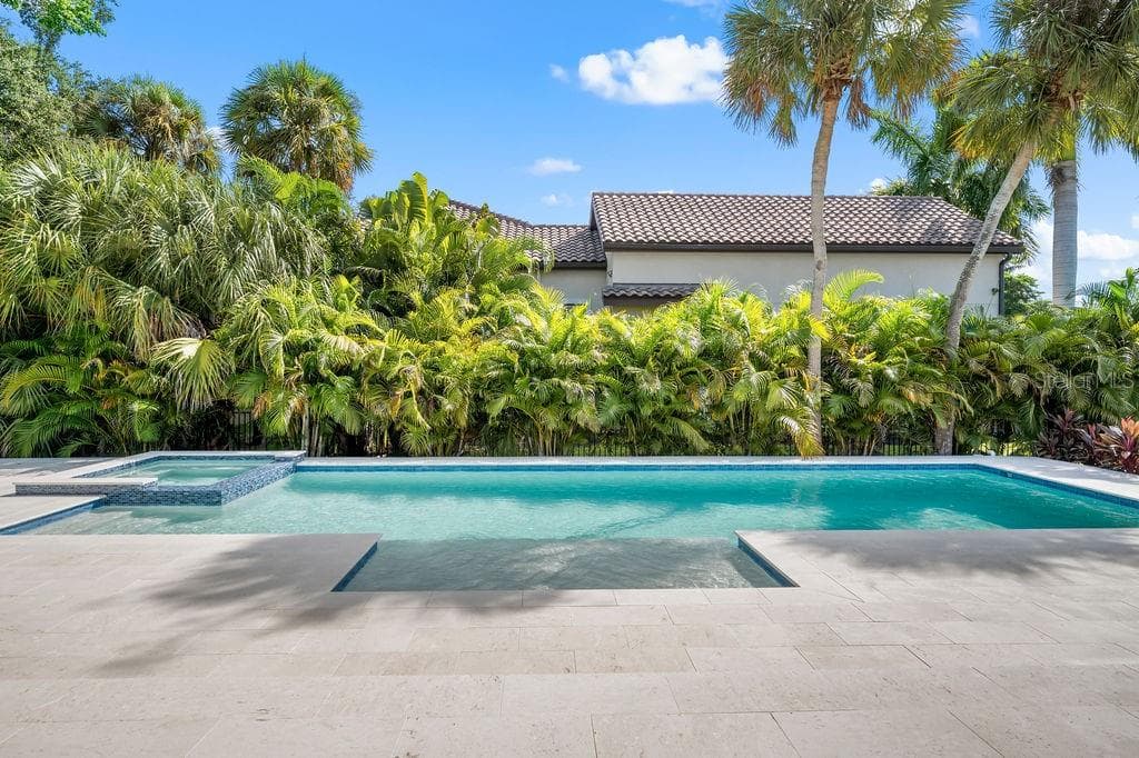 Heated saltwater pool has spa as well with plenty of sunlight and privacy. - 3360 BAYOU SOUND, LONGBOAT KEY