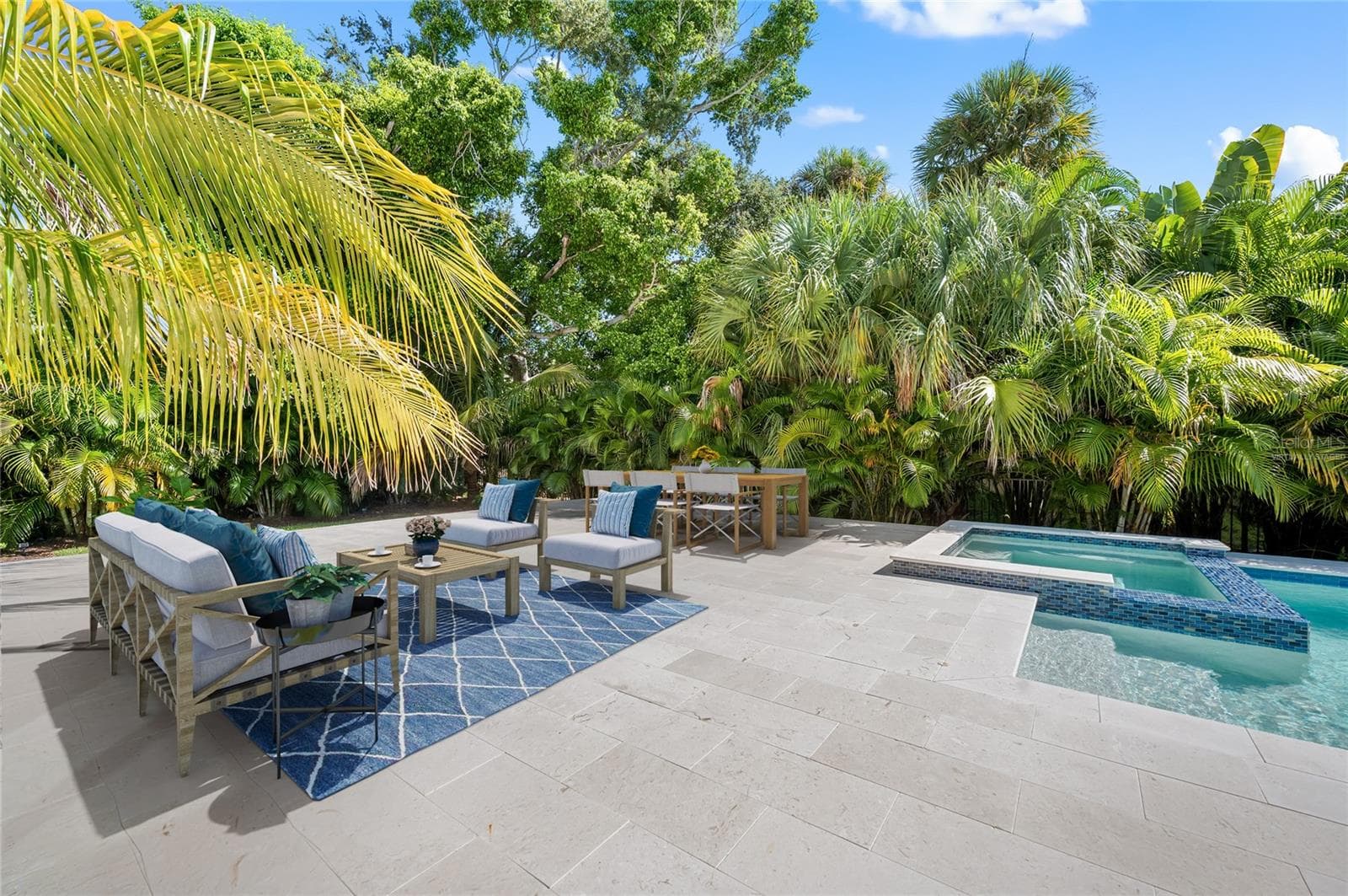 Virtually staged additional gathering space on pool deck in fenced and private back yard. - 3360 BAYOU SOUND, LONGBOAT KEY