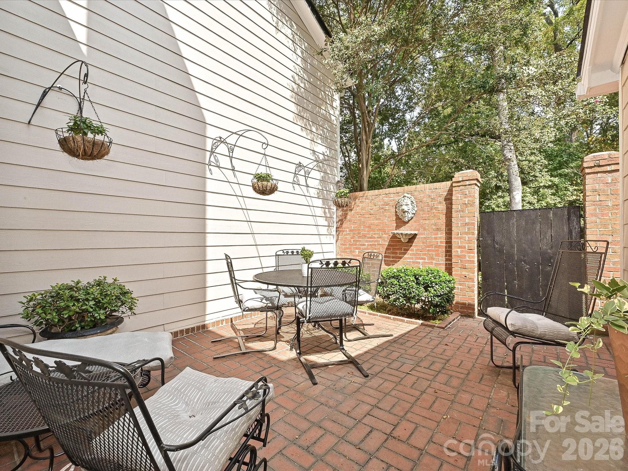 Private brick courtyard entrance gate to natural area - 4313 Silo Lane, Charlotte