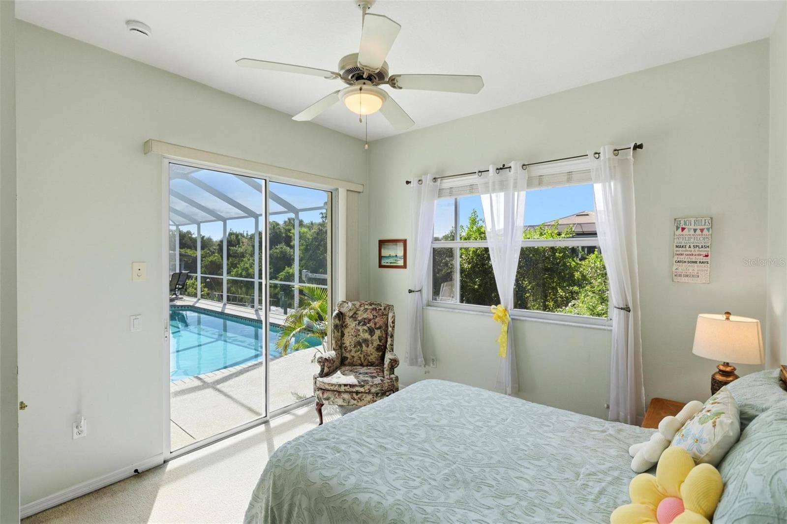 back auxiliary bedroom opens to the pool & lanai - 26419 VIEW DR, PUNTA GORDA