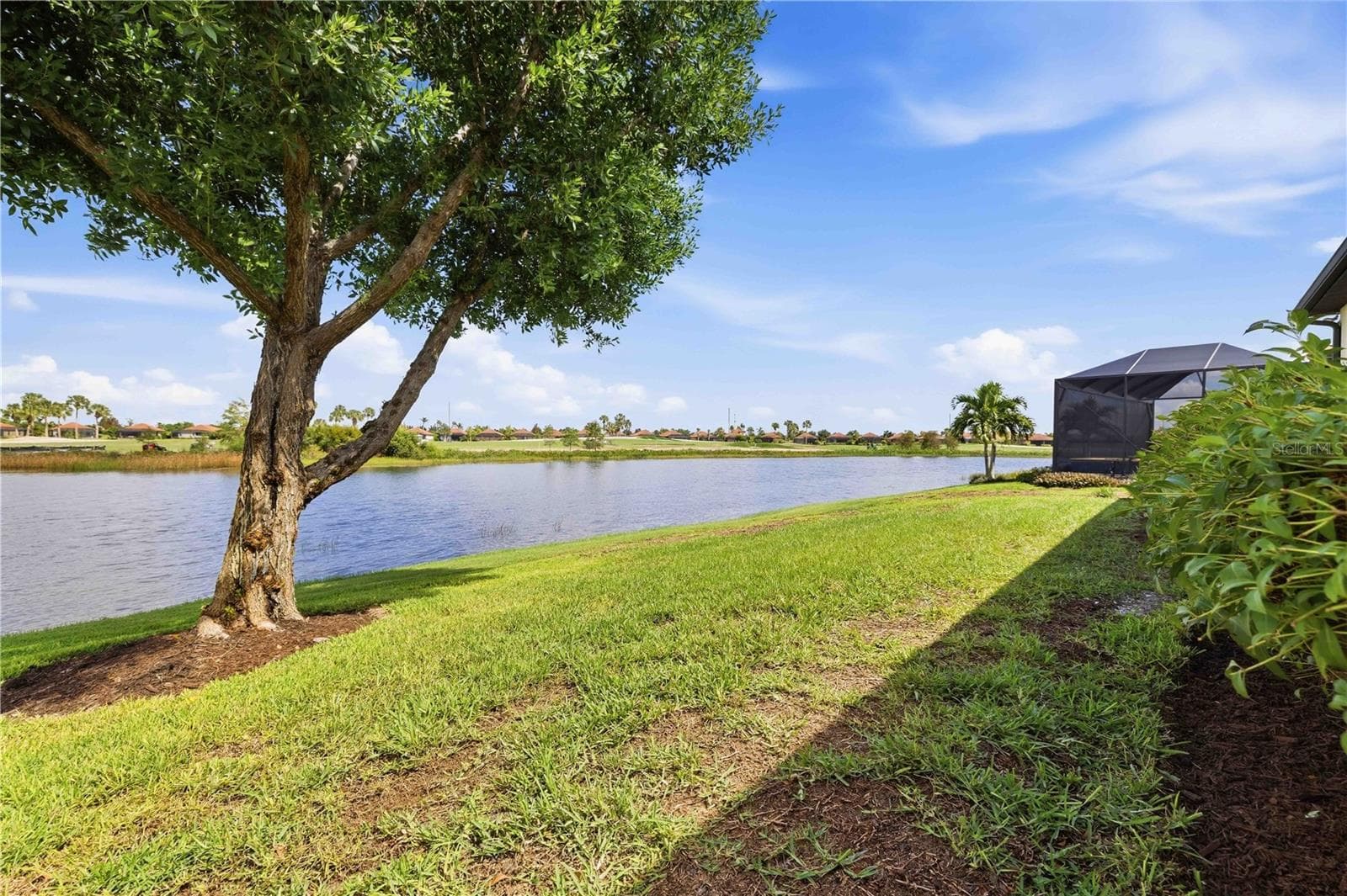 Back of the home - large enough for a pool and lanai - beautiful water and golf course views - 23739 WAVERLY CIR, VENICE
