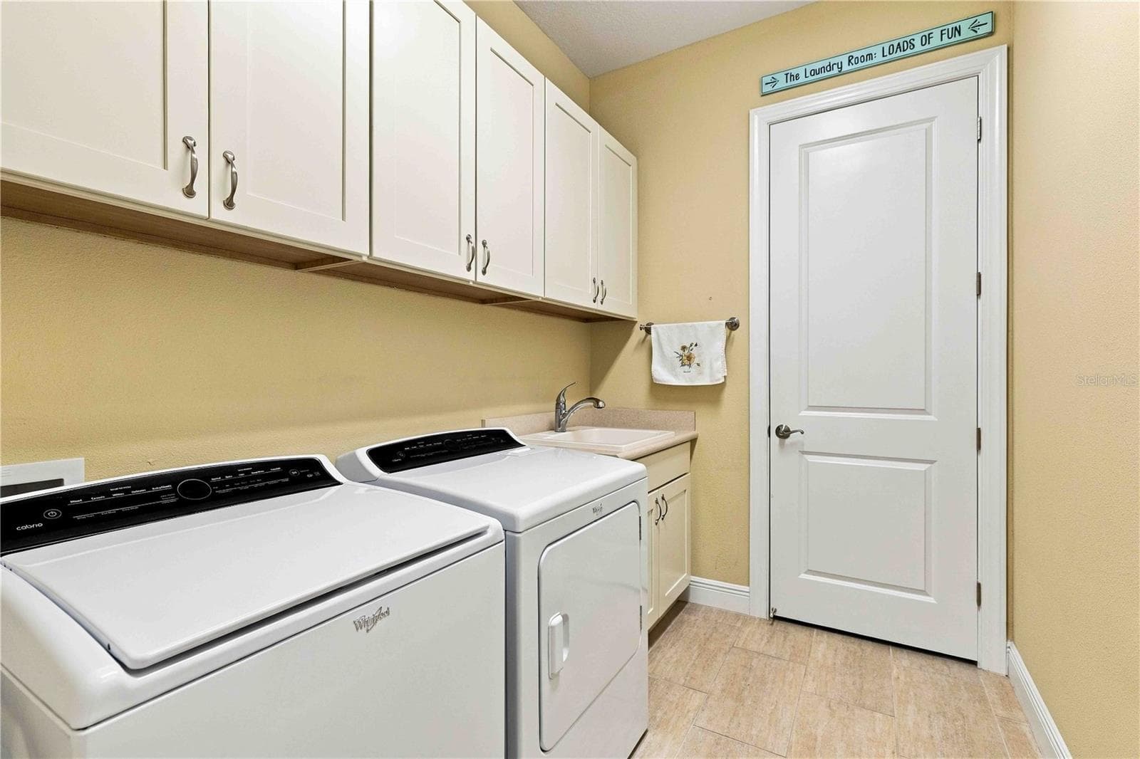 Inside Utility Room - Cabinets and utility sink - 23739 WAVERLY CIR, VENICE