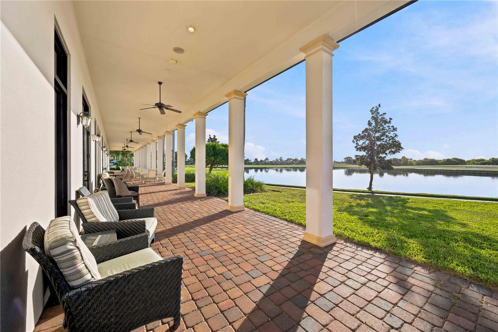 Lanai outside of the Palm Club overlooking water - great for dining - 23739 WAVERLY CIR, VENICE