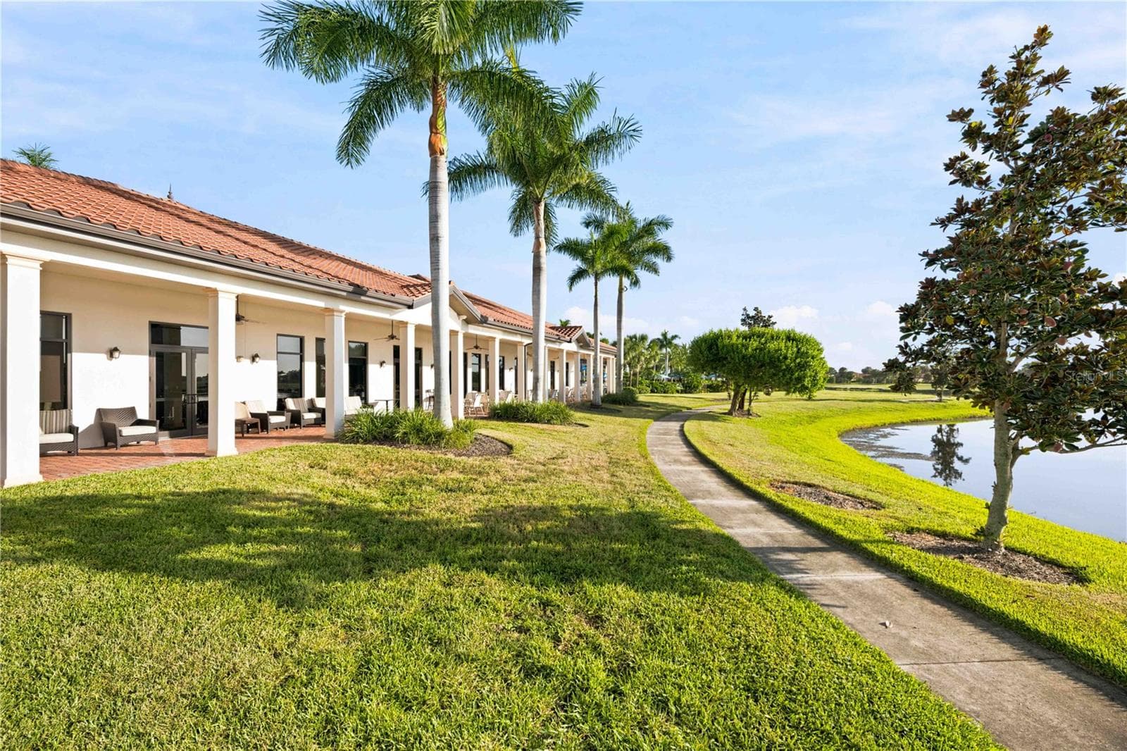 Lanai outside of the Palm Club overlooking water - great for dining - 23739 WAVERLY CIR, VENICE