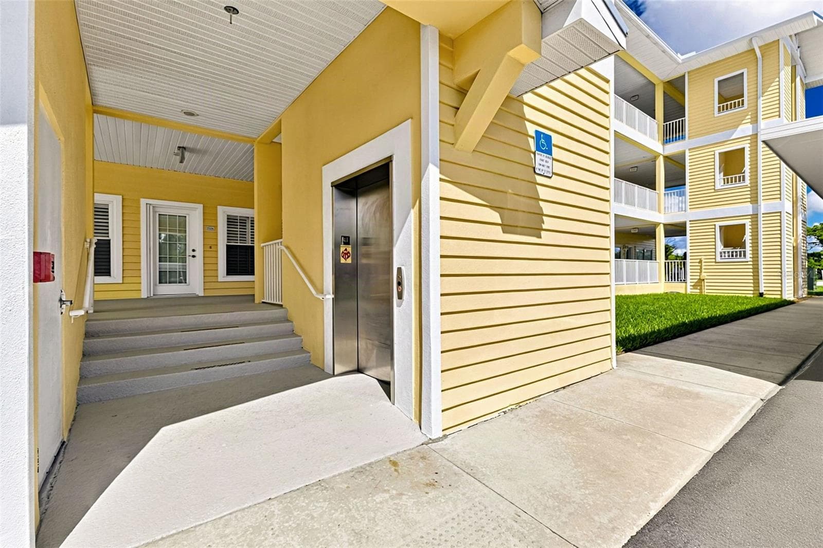 Elavater centrally located as well as stairs on either end of the building - 101 NATURES WAY #1307, ROTONDA WEST