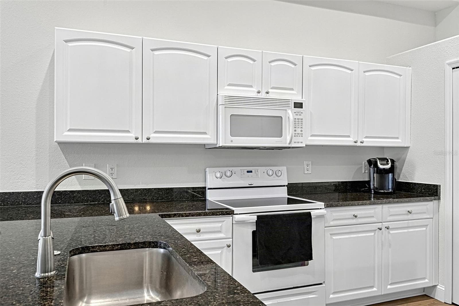 Granite countertops and refurbished cabinets - 101 NATURES WAY #1307, ROTONDA WEST