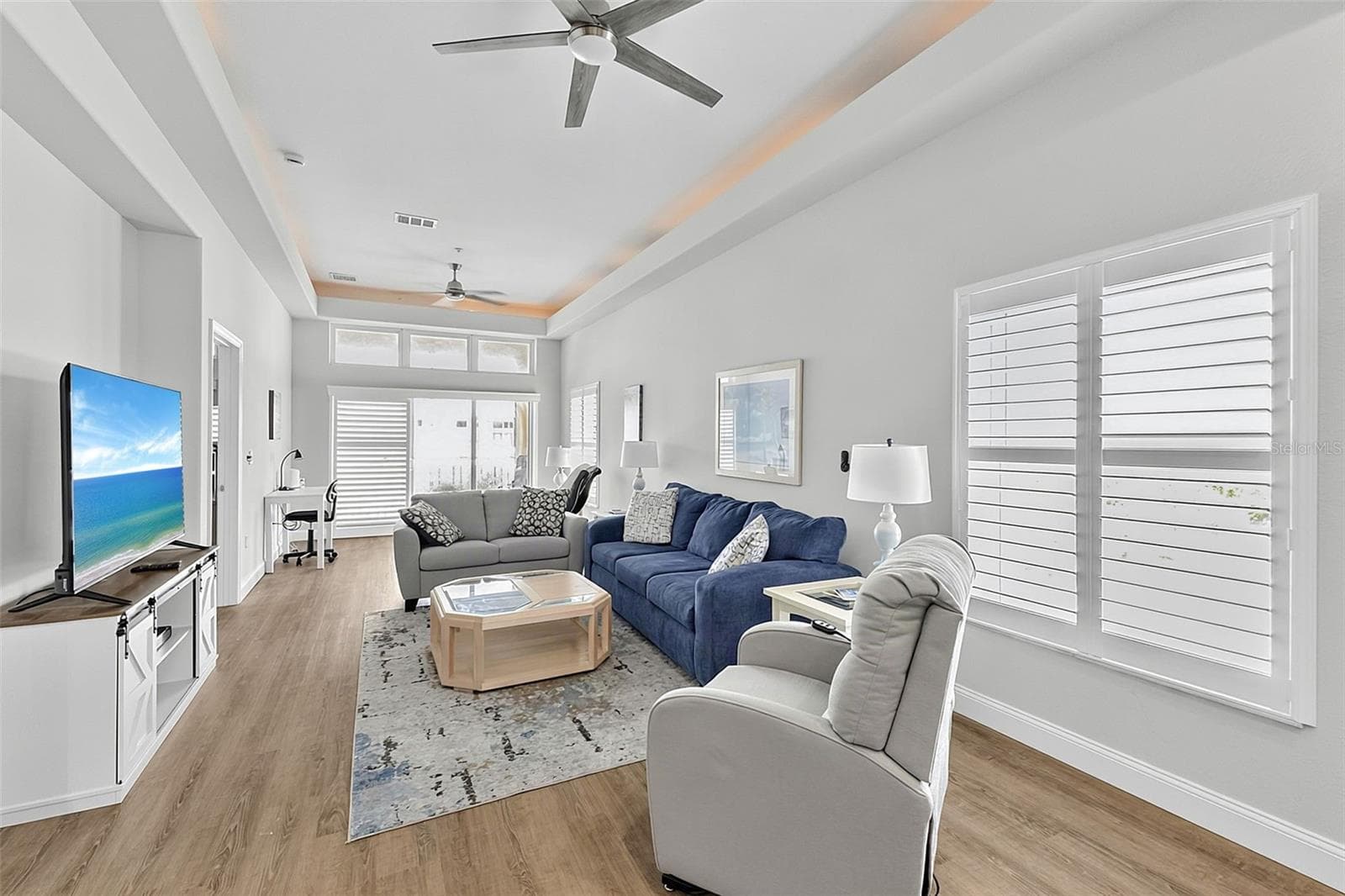 Great room with living and sitting space as well as a desk - 101 NATURES WAY #1307, ROTONDA WEST