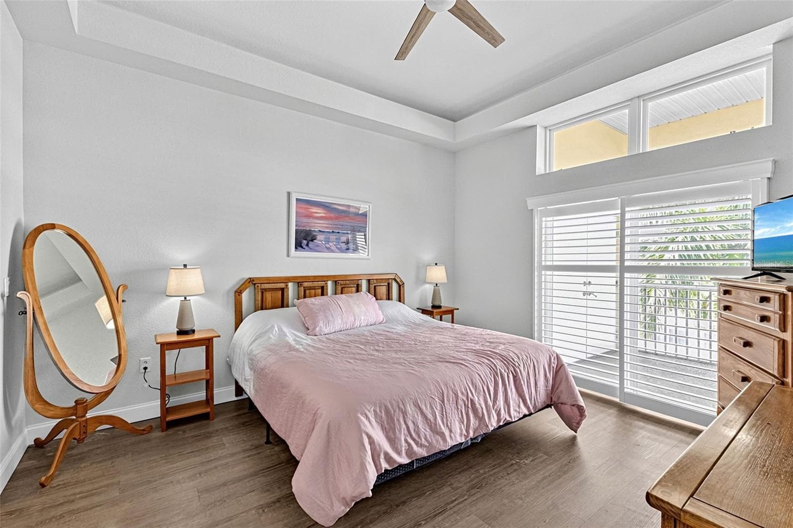 Primary bedroom with slider doors to the enclosed patio - 101 NATURES WAY #1307, ROTONDA WEST