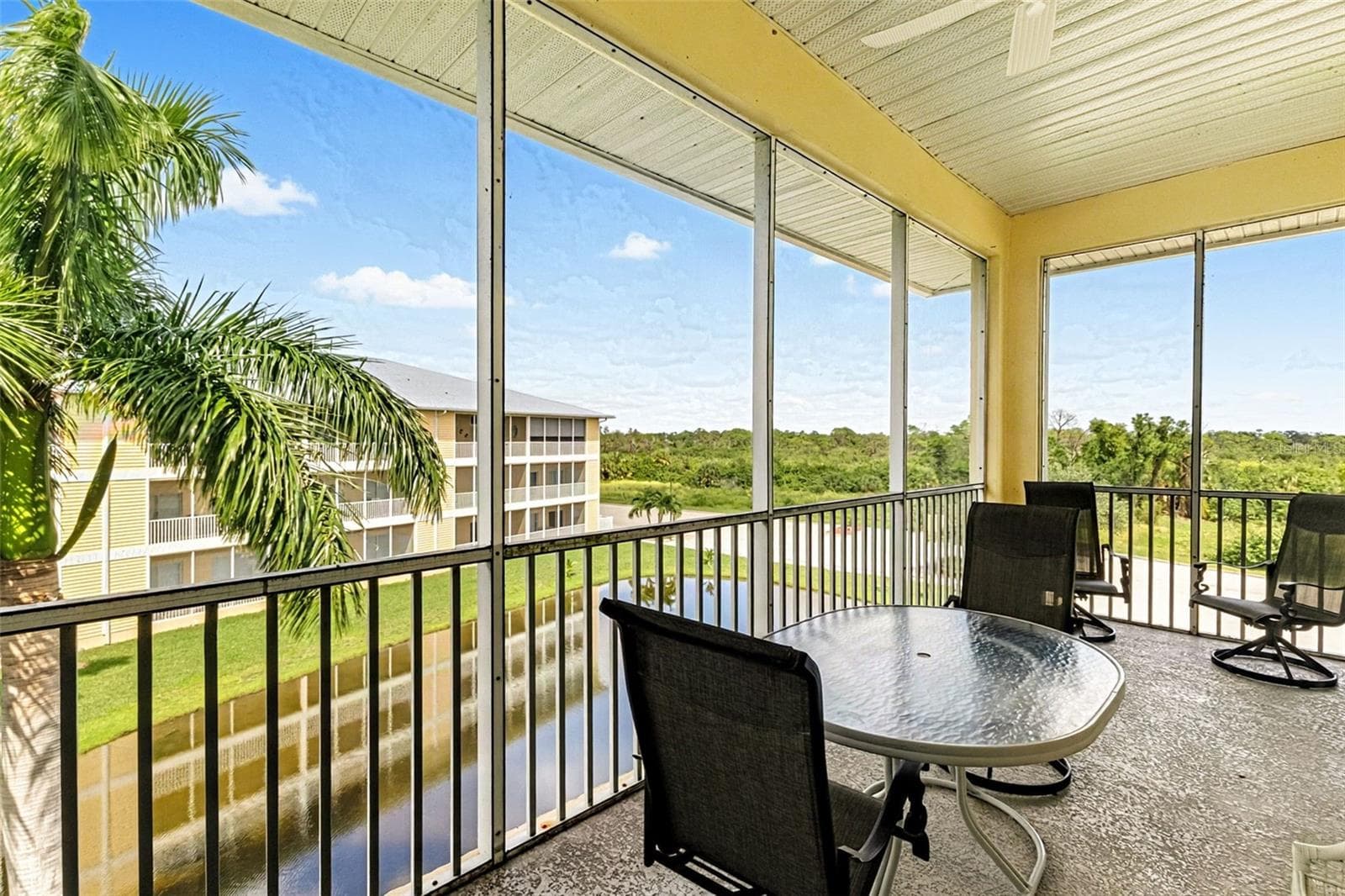 Patio view of preserve and pond with fountain ( nnot on at time of pictures) - 101 NATURES WAY #1307, ROTONDA WEST