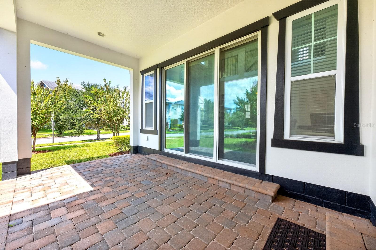 A wall of sliding glass doors creates the ultimate indoor/outdoor living. - 9024 NEHER ST, ORLANDO