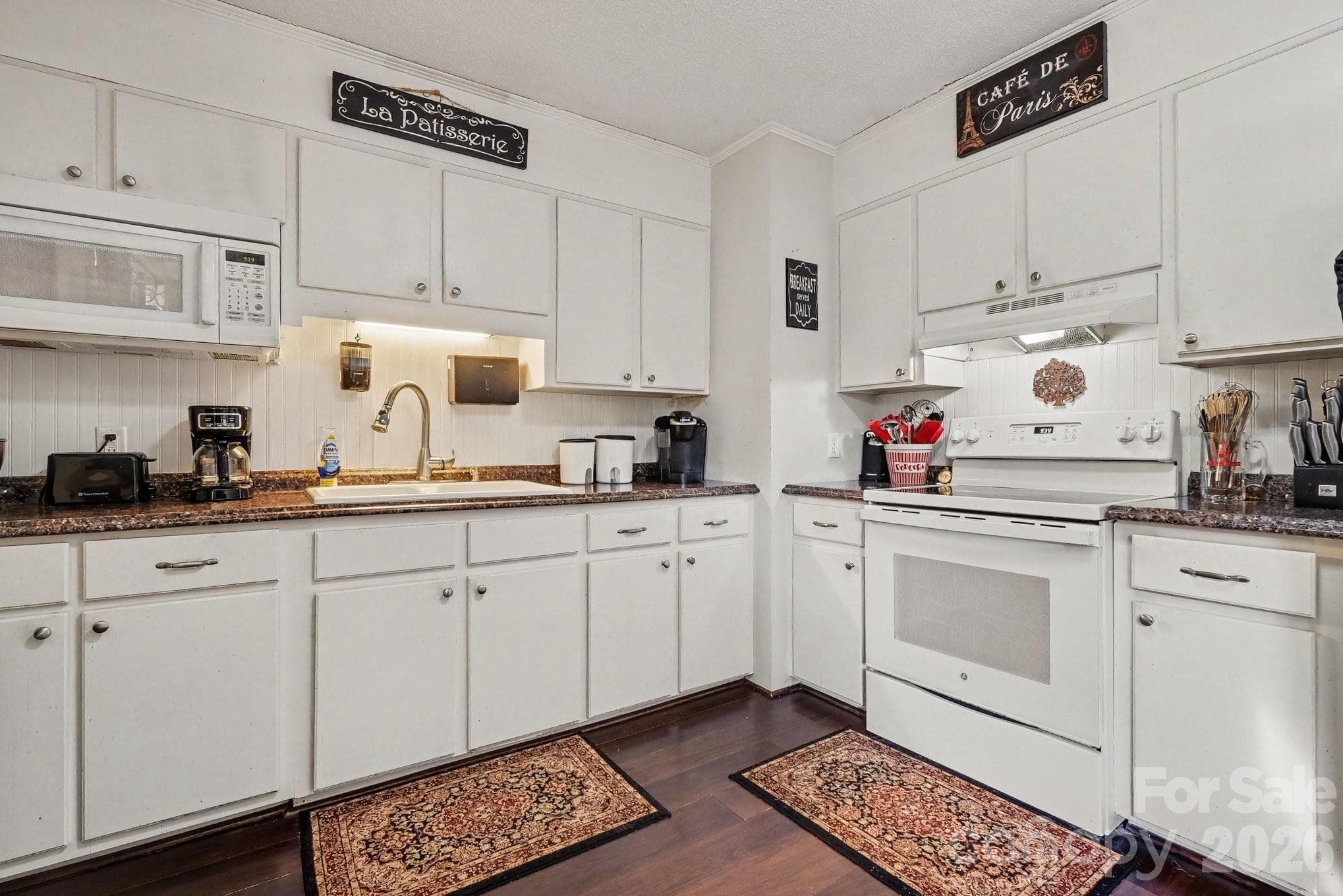 Kitchen view with white cabinets and white appliances. - 645 Pine Ridge Road, Chester