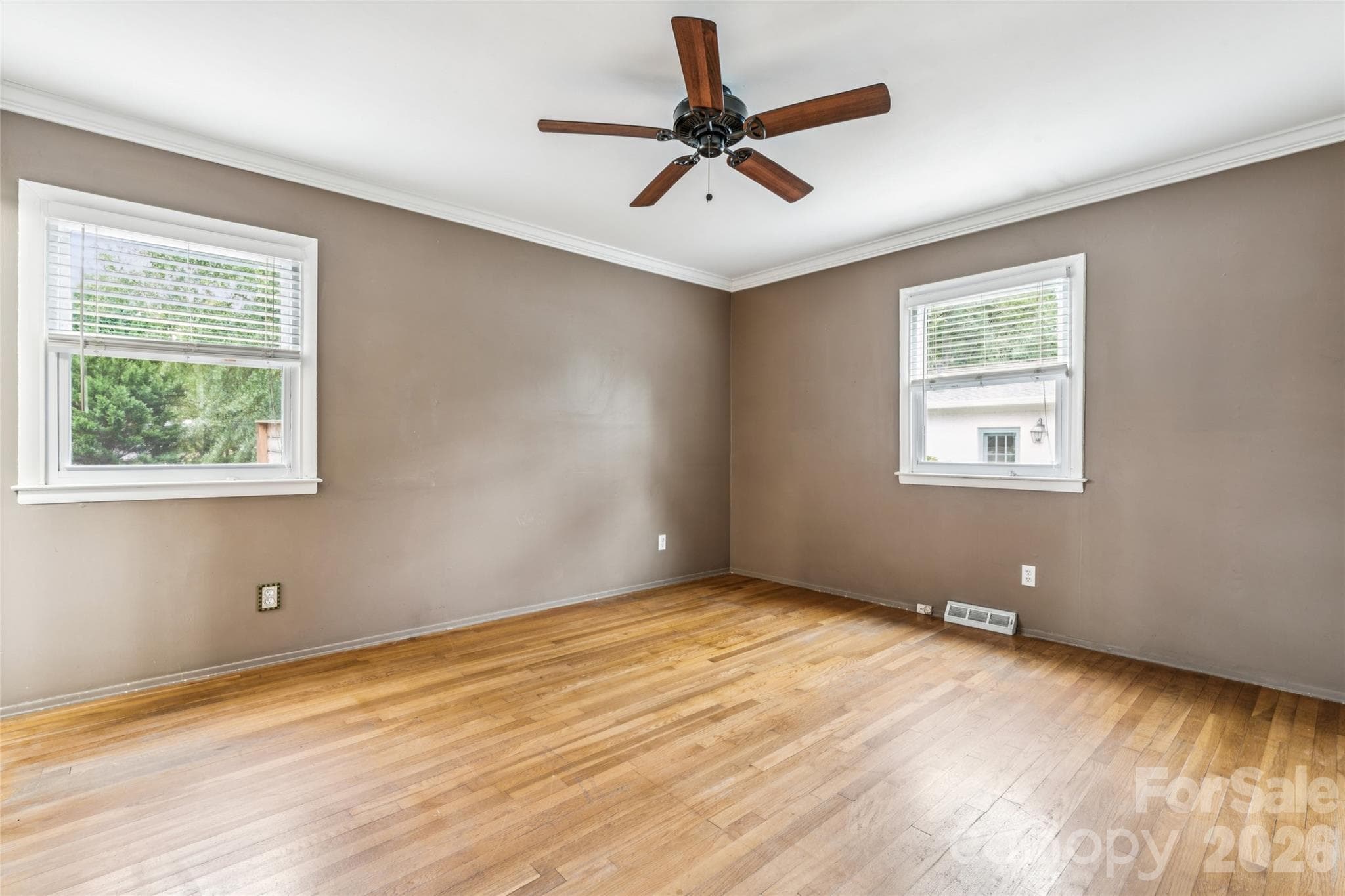 Light-filled primary bedroom. - 6501 Wheeler Drive, Charlotte