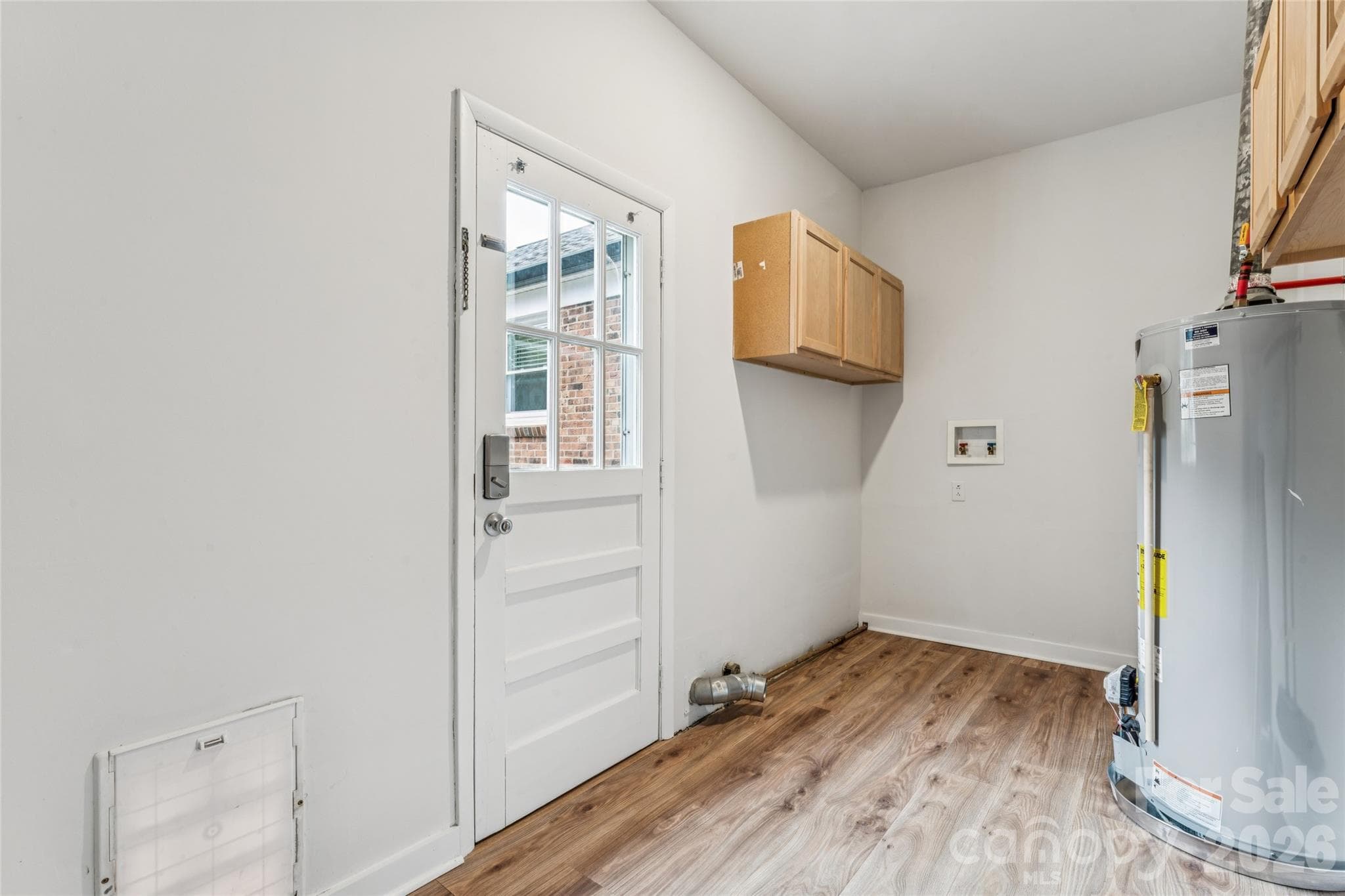 Laundry room with access to rear deck & yard. - 6501 Wheeler Drive, Charlotte