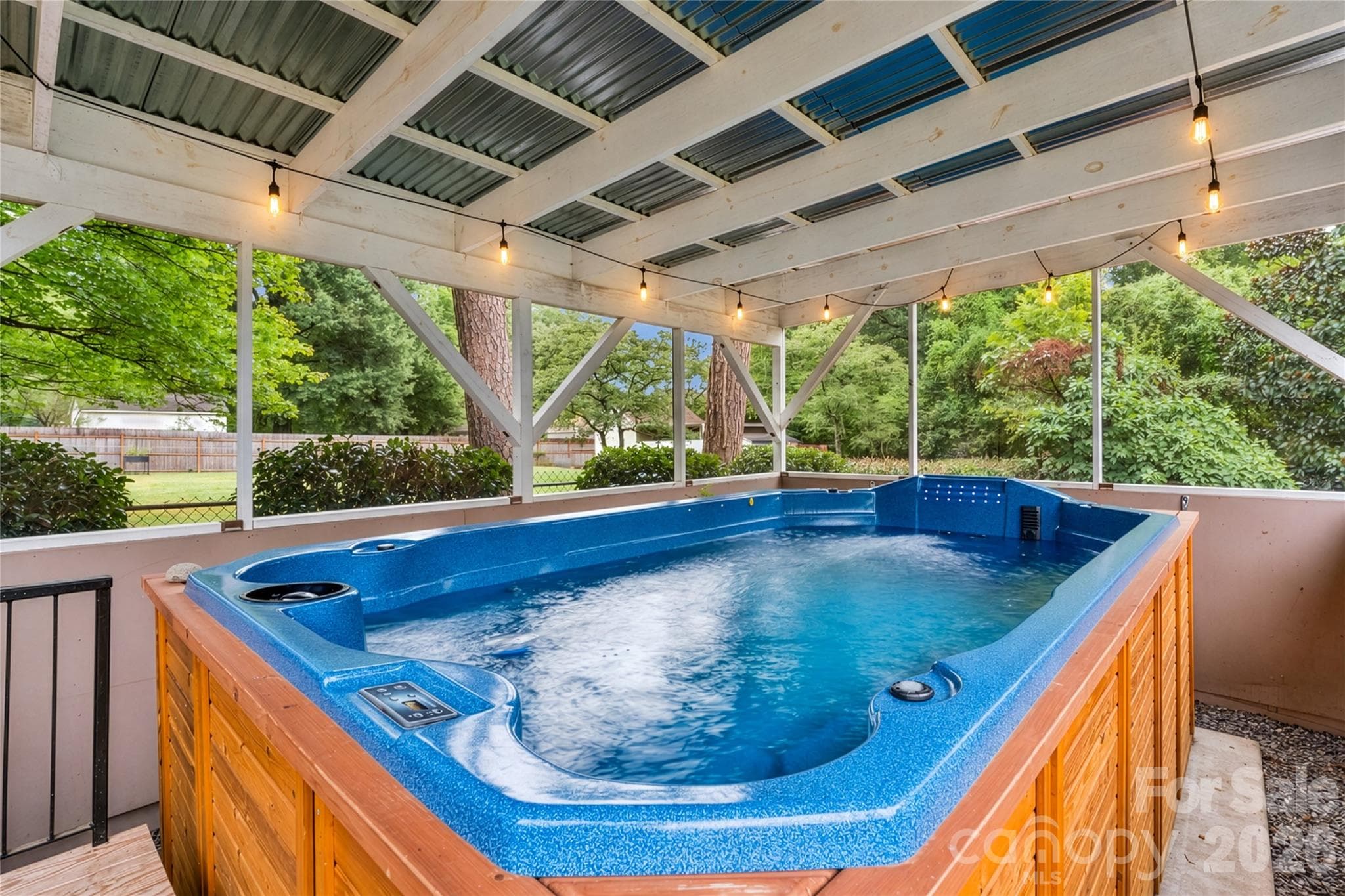Enjoy the swim spa year-round. - 6501 Wheeler Drive, Charlotte