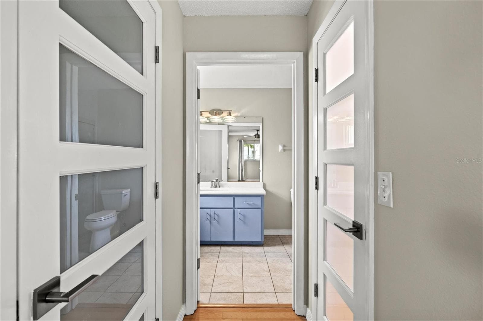 Primary closets and ensuite bath - 7129 QUEEN PALM CIR, SARASOTA