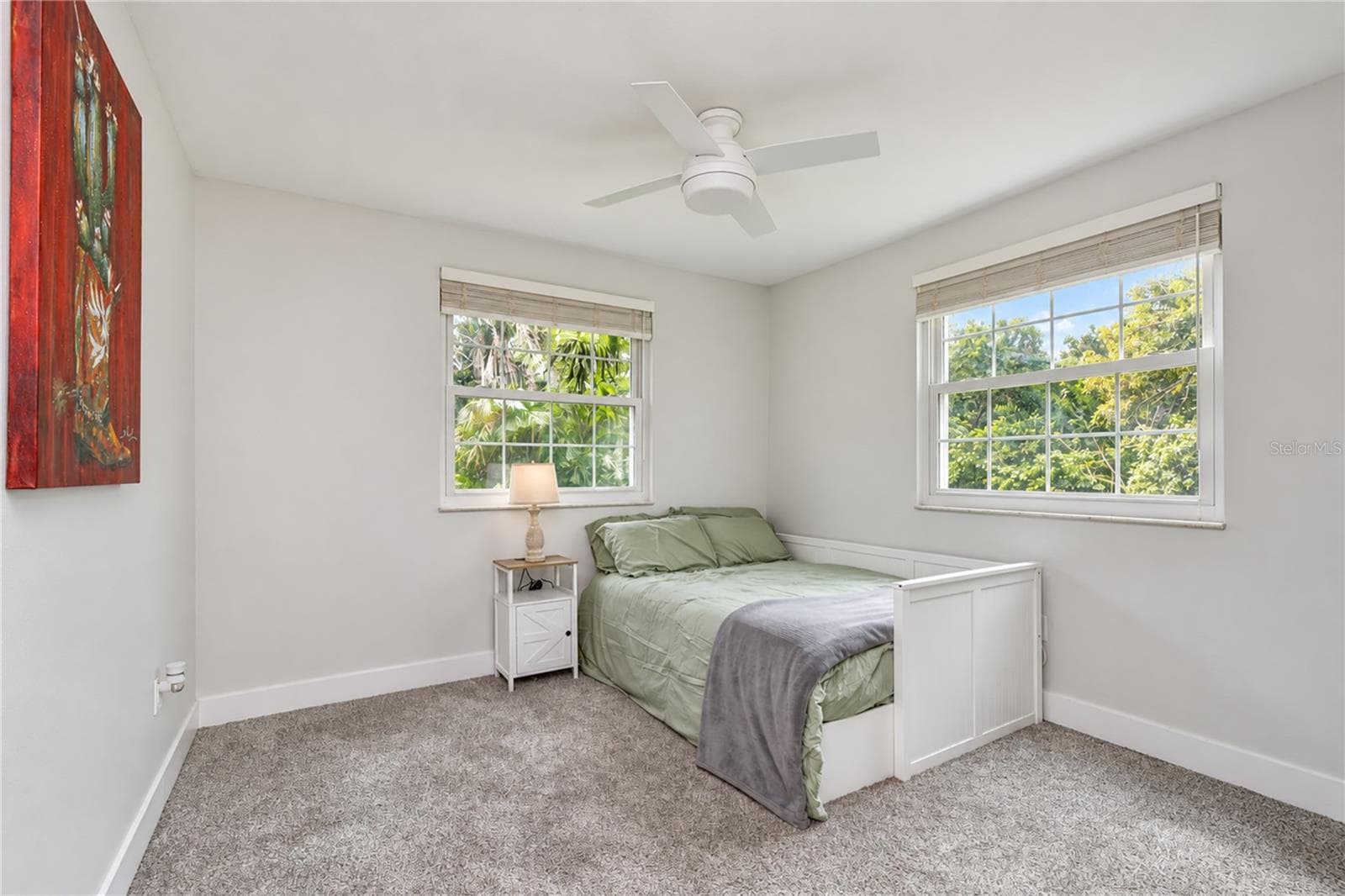 Comfortable secondary bedroom with easy access to the remodeled guest bath - 901 WOODVIEW DR, BRANDON
