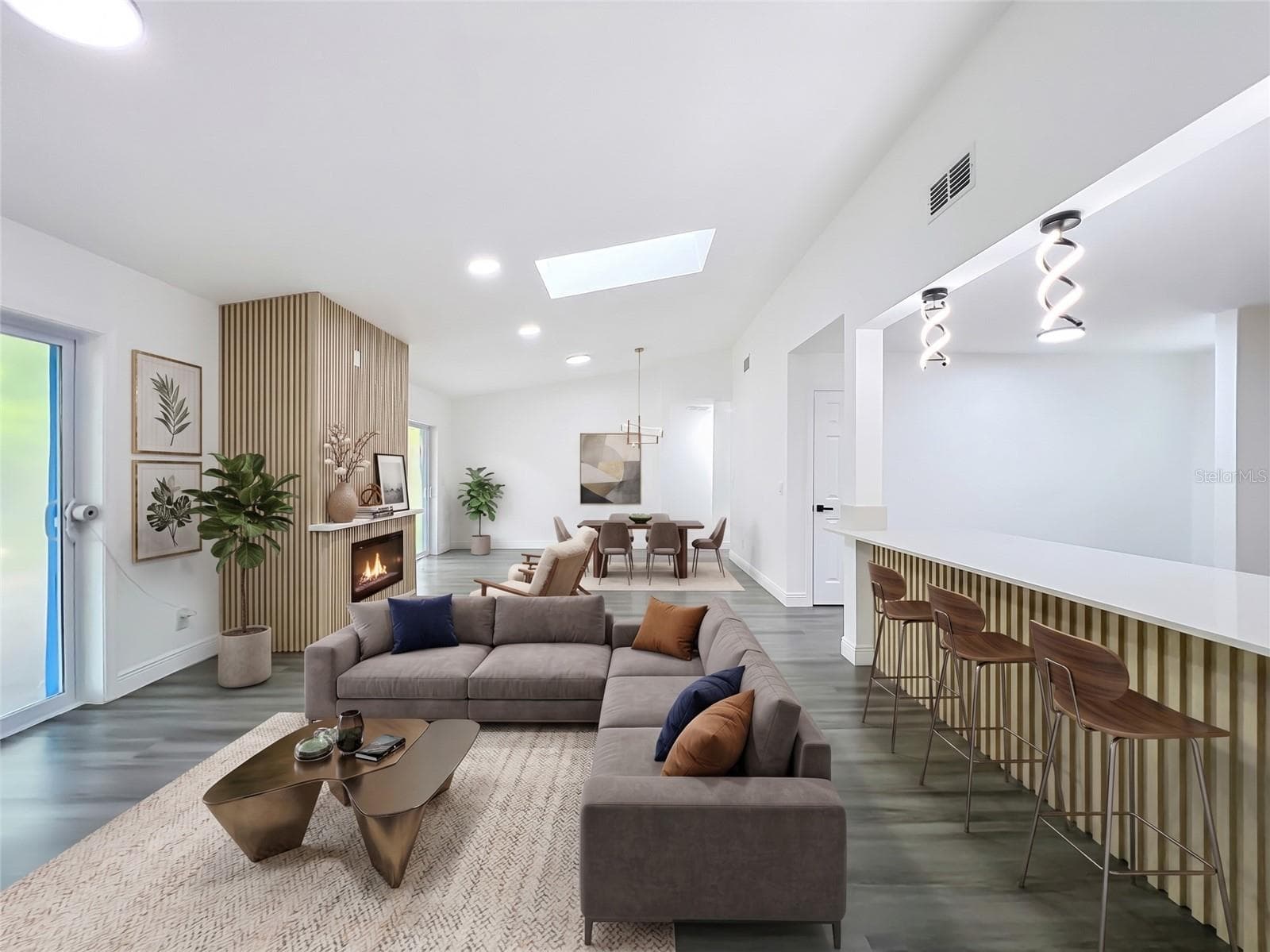Imagine yourself here! Open-concept living with a stunning electric fireplace. - 5610 SHASTA DR, ORLANDO