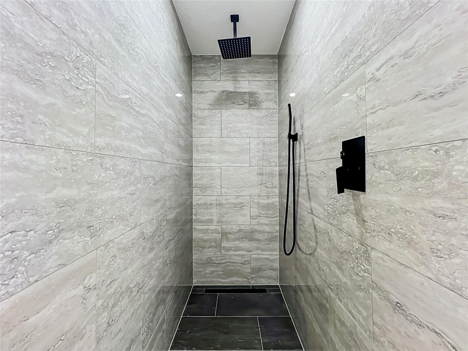 Oversized tiled walk-in shower with rainfall-style showerhead! - 5610 SHASTA DR, ORLANDO