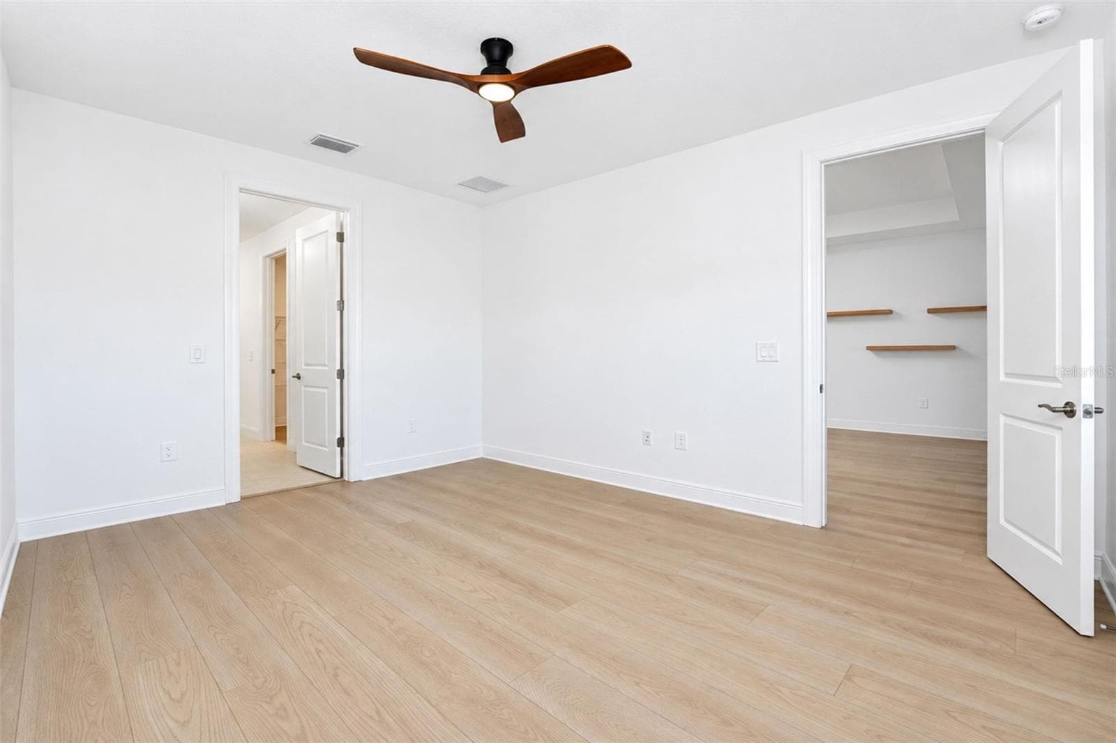 Spacious owners suite featuring beautiful plank flooring and a private en-suite bath - 237 VISTERA BLVD, NOKOMIS