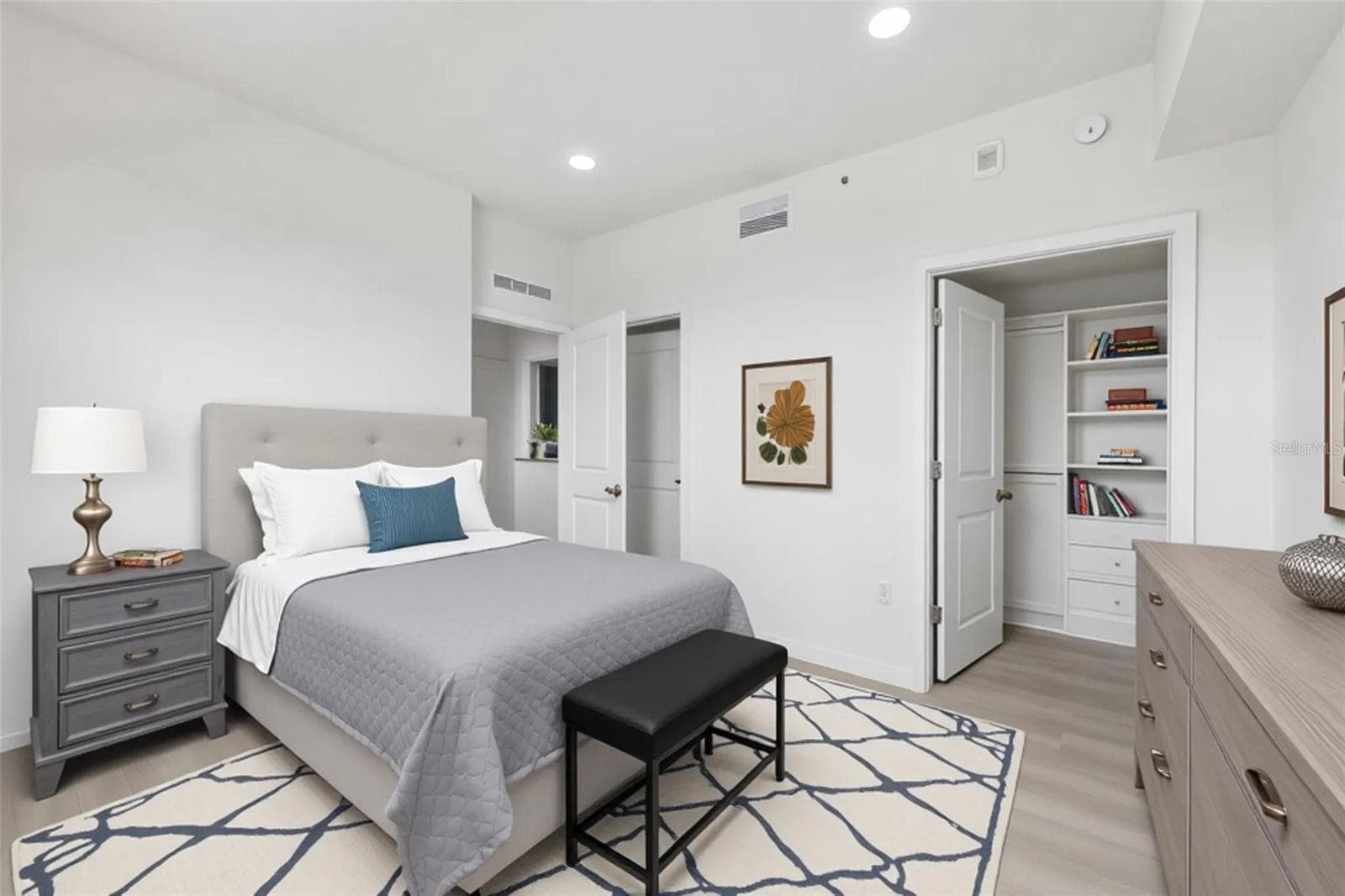Primary bedroom with built-in closet - 5587 MILLENIA PARK BLVD #203, ORLANDO