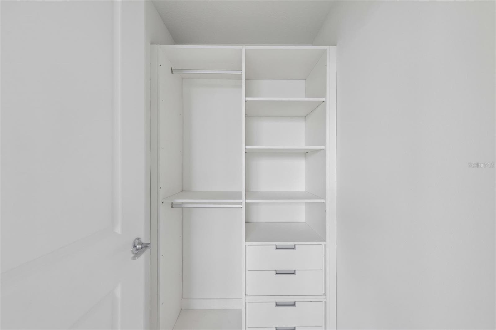 Primary bedroom with built-in closet - 5587 MILLENIA PARK BLVD #203, ORLANDO