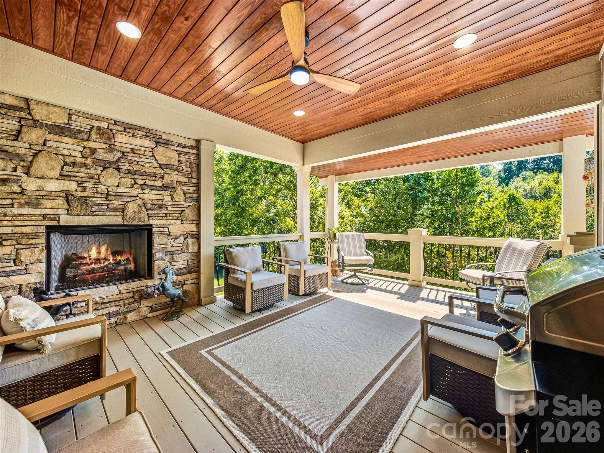 Gas fireplace on the main level back porch - 158 Narrows Run Loop, Hendersonville