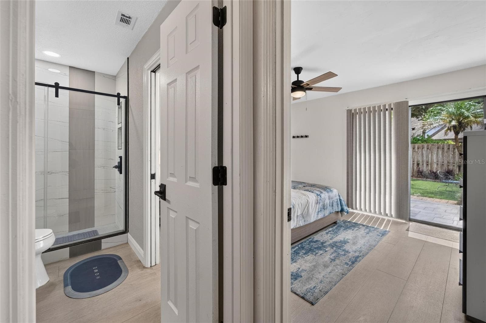 View of both the primary bath and bedroom. - 5205 OAK CHARTER CT, TEMPLE TERRACE