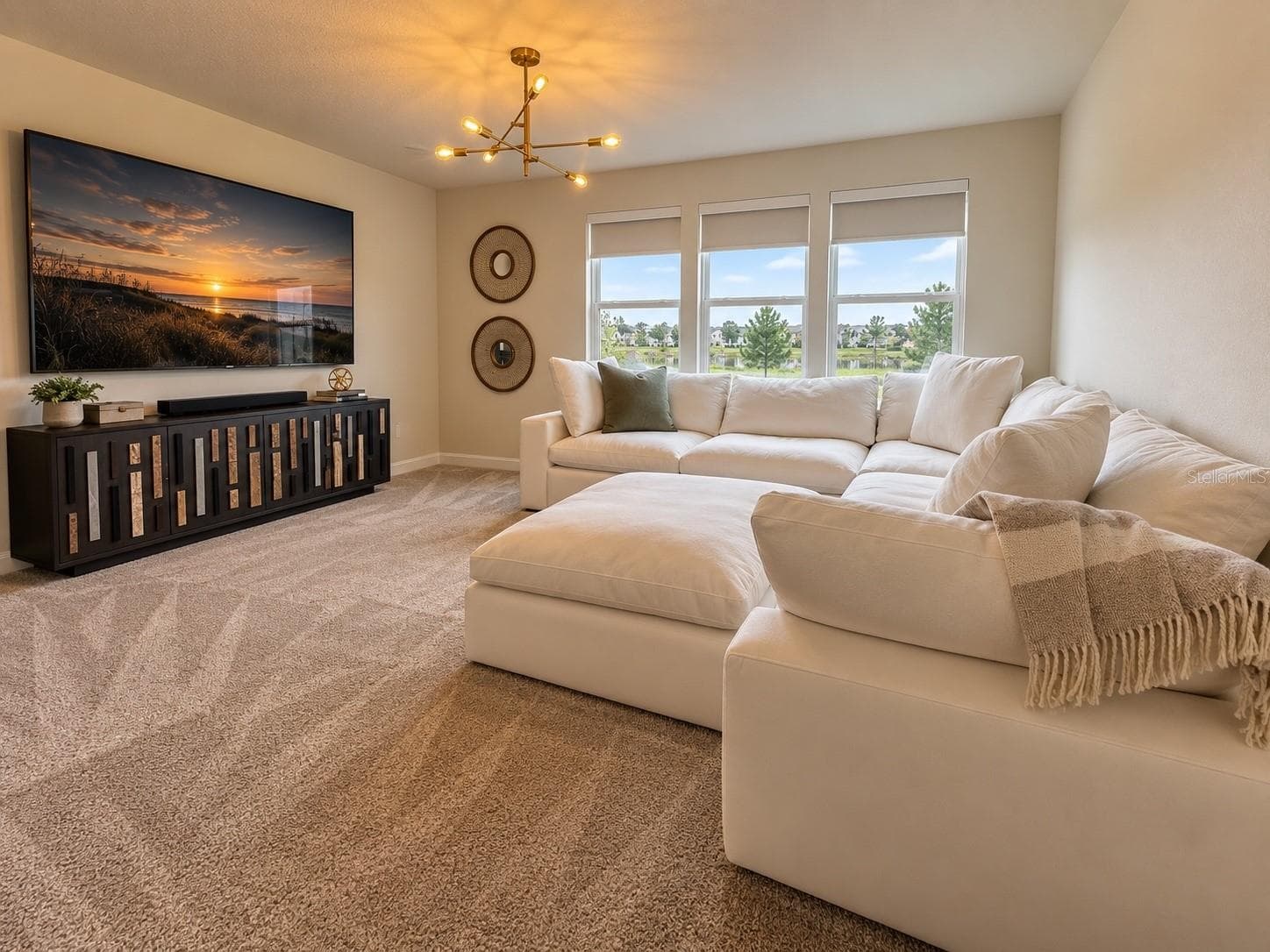 Spacious second-floor loft offering a versatile additional living area, ideal for a media room, family lounge, or entertainment space, with abundant natural light and serene views. - 6735 REVERIE PARK AVE, ORLANDO