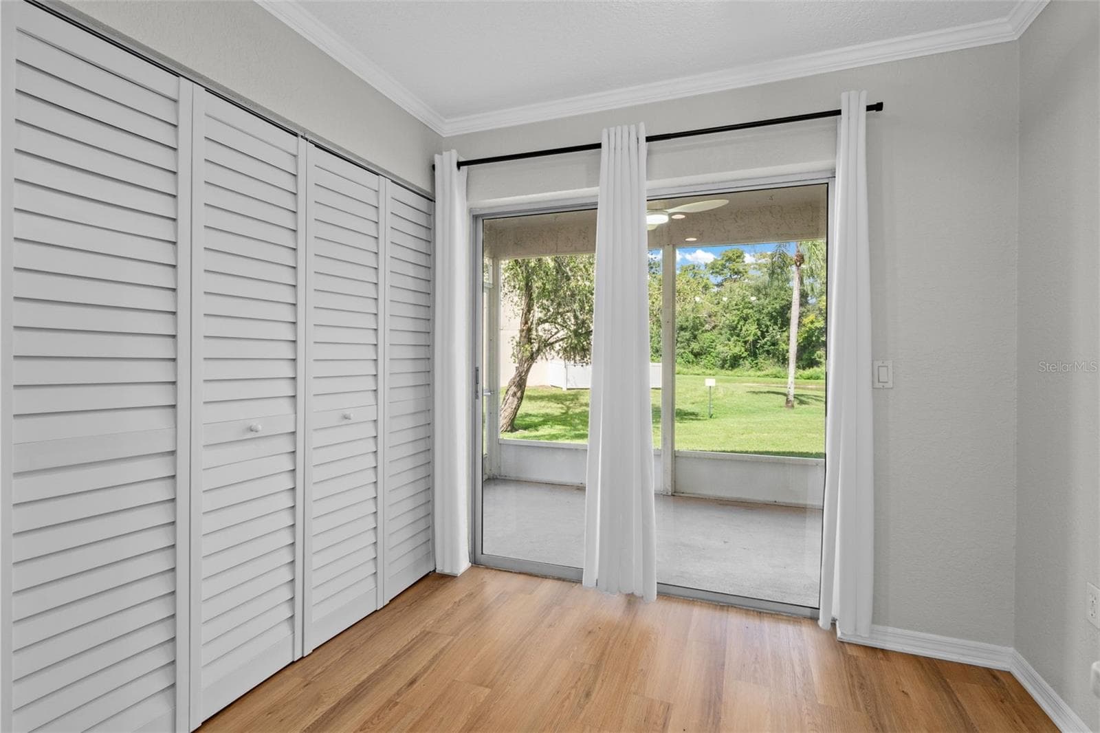 Dinette area with sliding door access to the screened lanai - 7924 HARDWICK DR #617, NEW PORT RICHEY