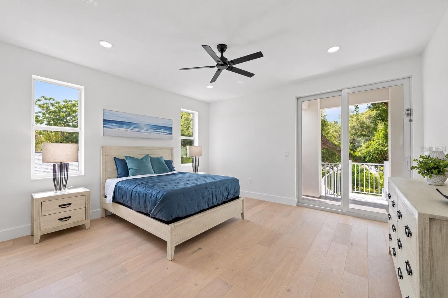 Guest bedroom, with access to the balcony that has the spiral staircase to the pool deck - 1647 SIESTA DR, SARASOTA