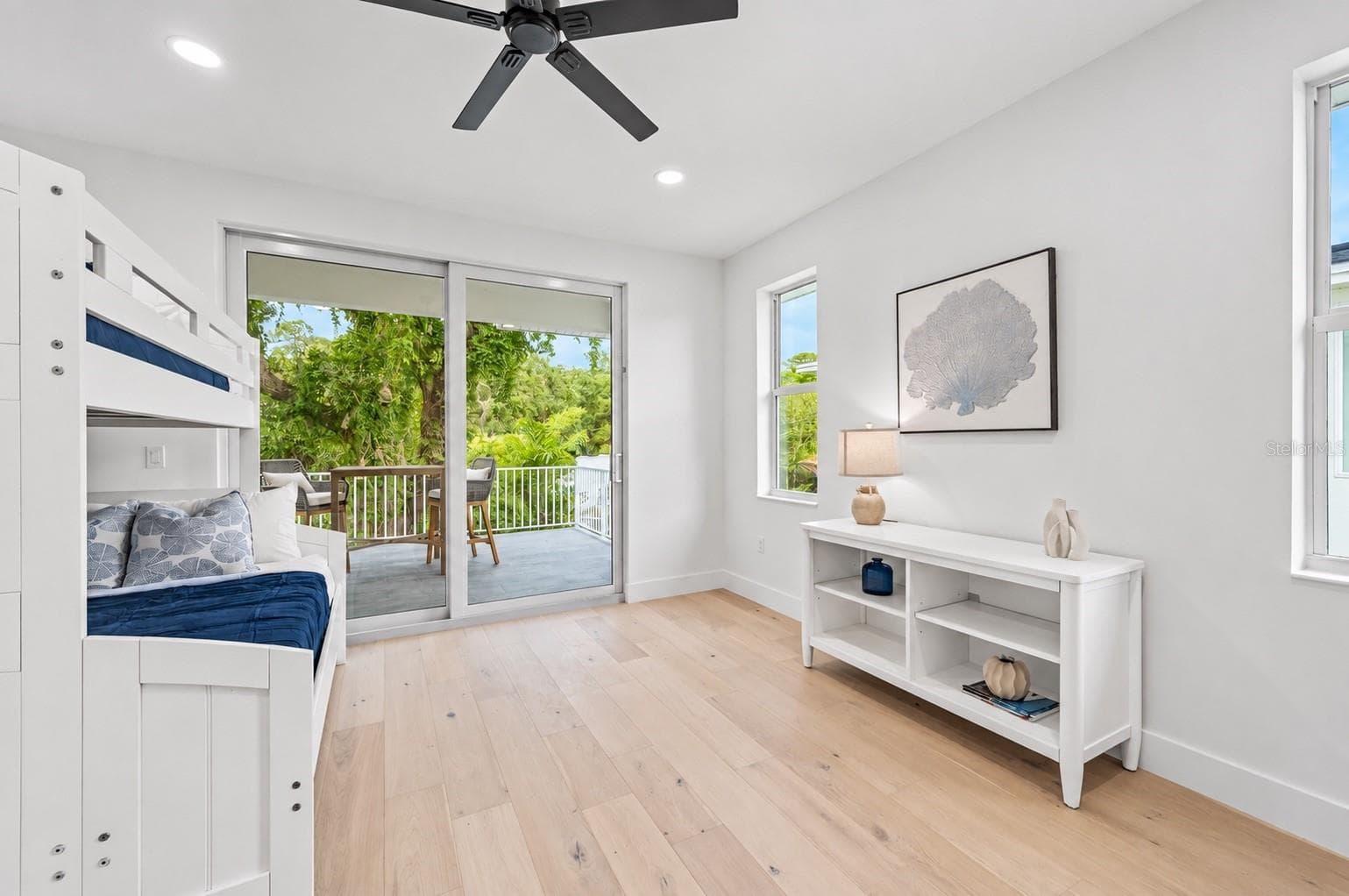 Guest bedroom, with access to the balcony that has the spiral staircase to the pool deck - 1647 SIESTA DR, SARASOTA