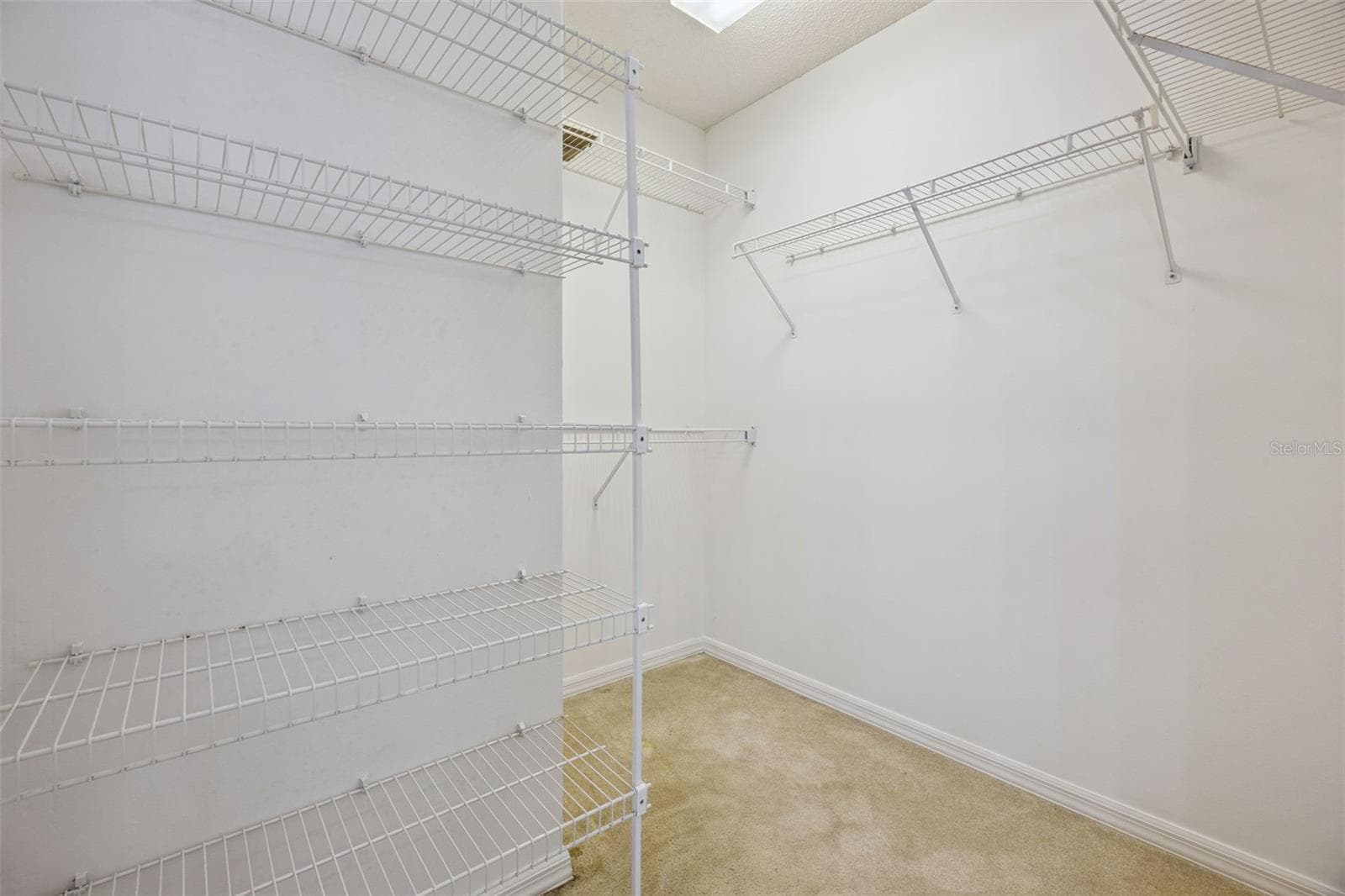 Primary walk in closet - 8370 SANDPOINT BLVD, ORLANDO