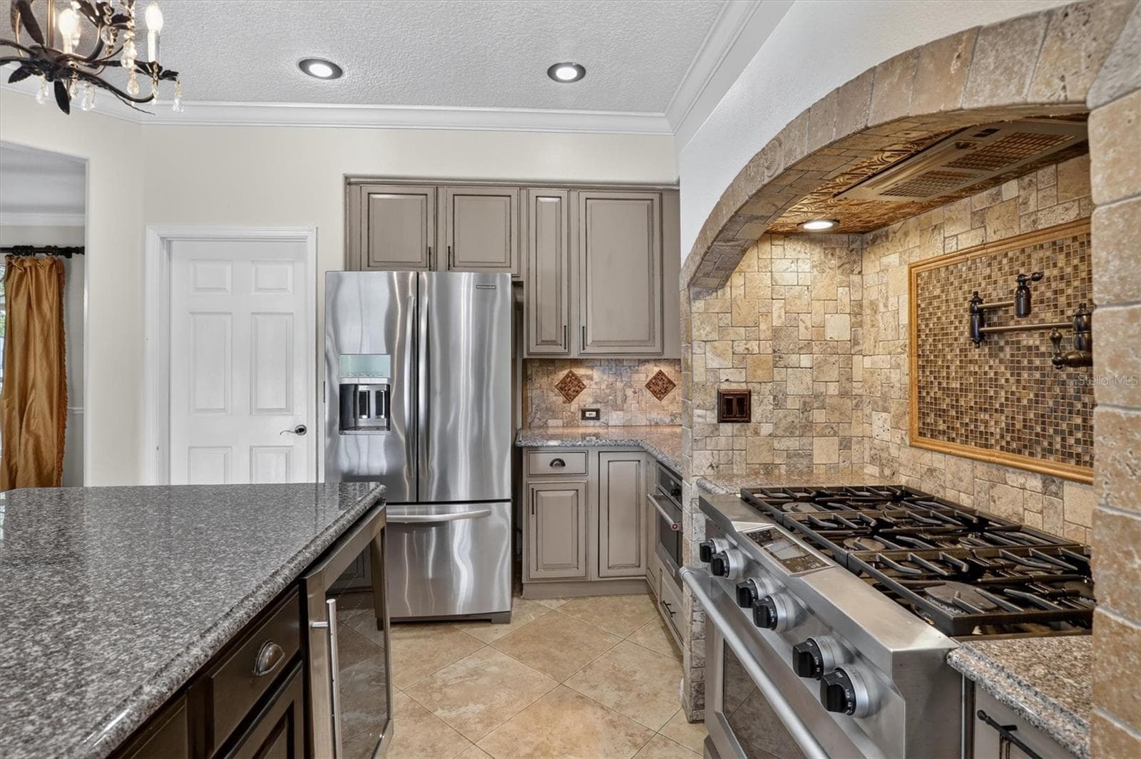 Kitchen with stainless steel appliances and ample workspace. - 2109 WEMBLEY PL, OVIEDO