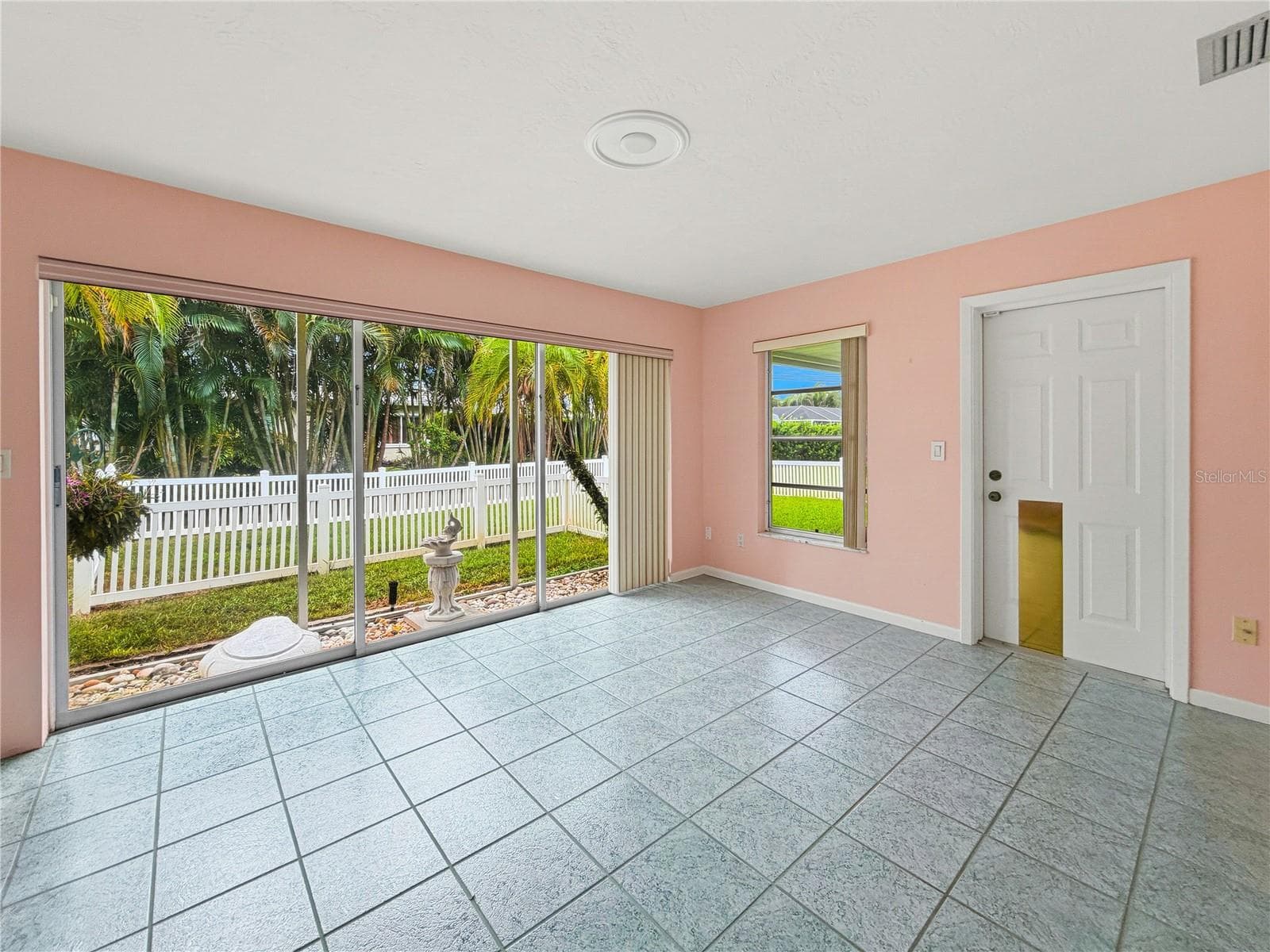 Large Family Room with Screened Garden Feature and Entrance to Large Covered Patio - 14036 THACHER AVE, LARGO