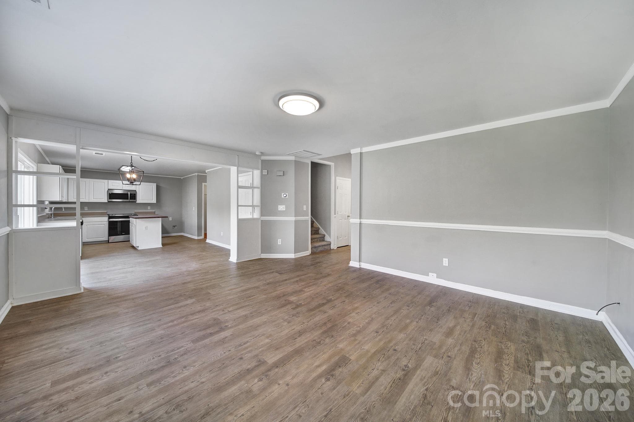 Family room flows into the dining room and kitchen - 5228 Moonlight Trail SW, Concord