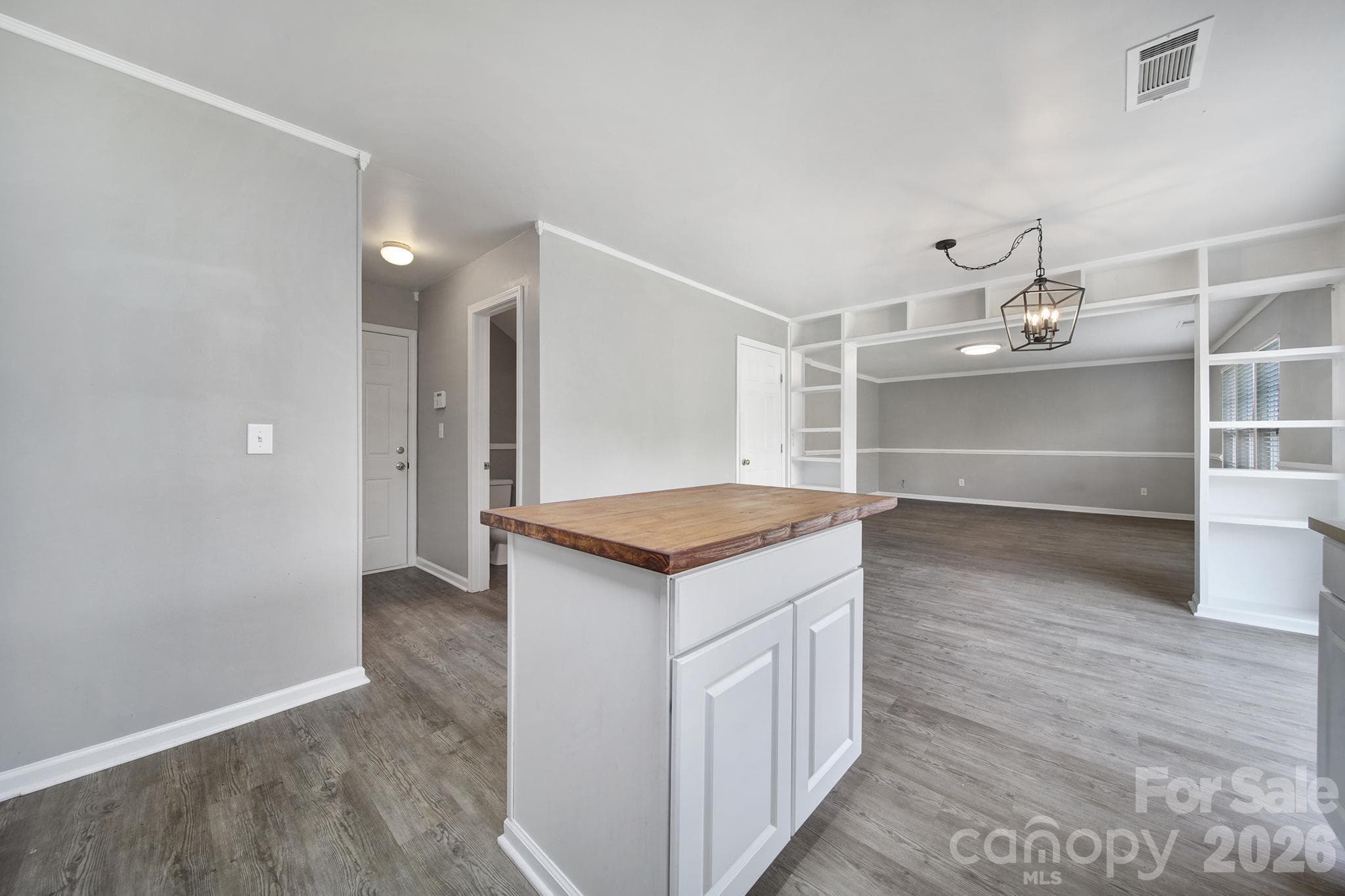Laundry Room and Half-Bath located in the hallway towards garage entry. - 5228 Moonlight Trail SW, Concord