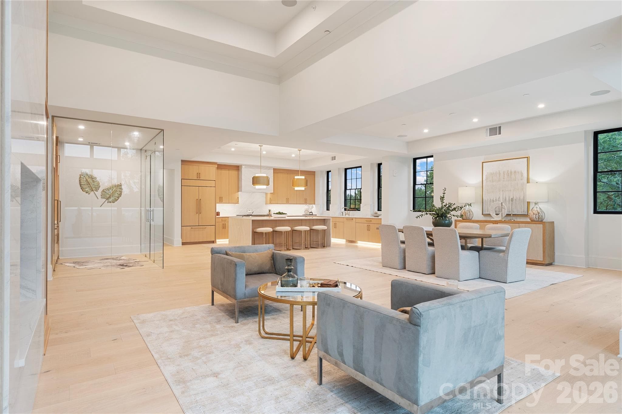 Another look at the expansive family area where the kitchen, dining and casual seating areas flow together seamlessly, with views from every direction. - 409 Queens Road, Charlotte