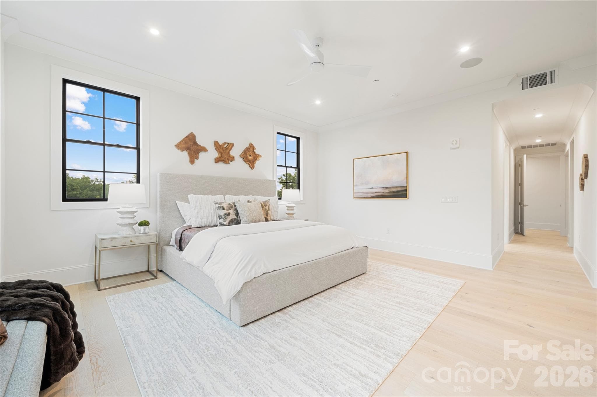 Looking across the spacious primary bedroom to the hall which leads to the private bathroom & walk-in closet. - 409 Queens Road, Charlotte