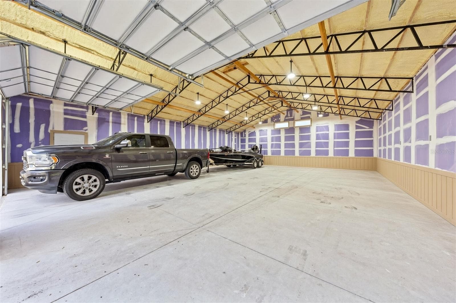 36' x 48' Interior of the Detached Garage with 2 Bay Doors and side entry door - 4349 PACKARD AVE, ST CLOUD