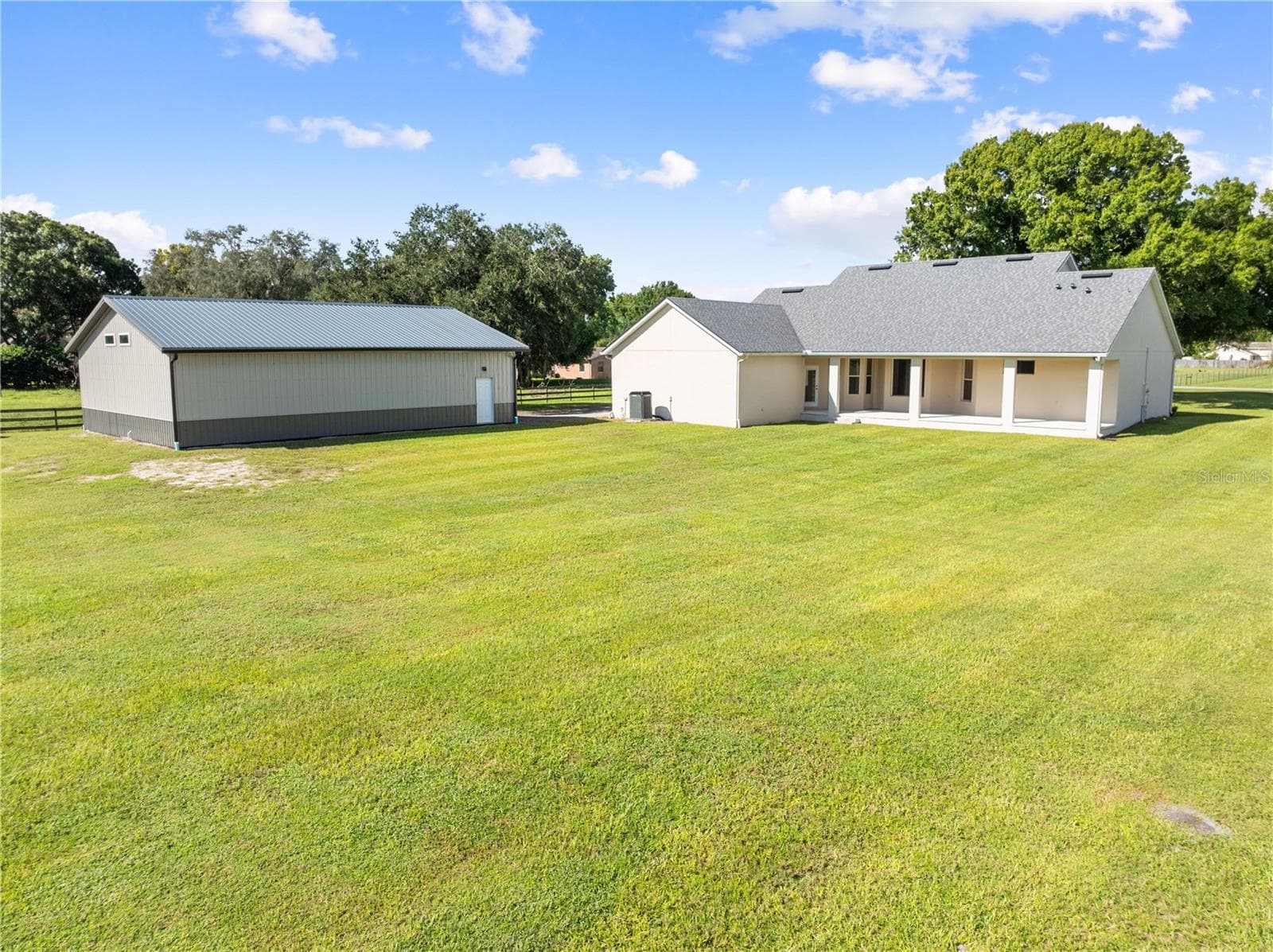 Exterior View of the home and Detached Garage - Plenty of room for pool and entertaining area. - 4349 PACKARD AVE, ST CLOUD